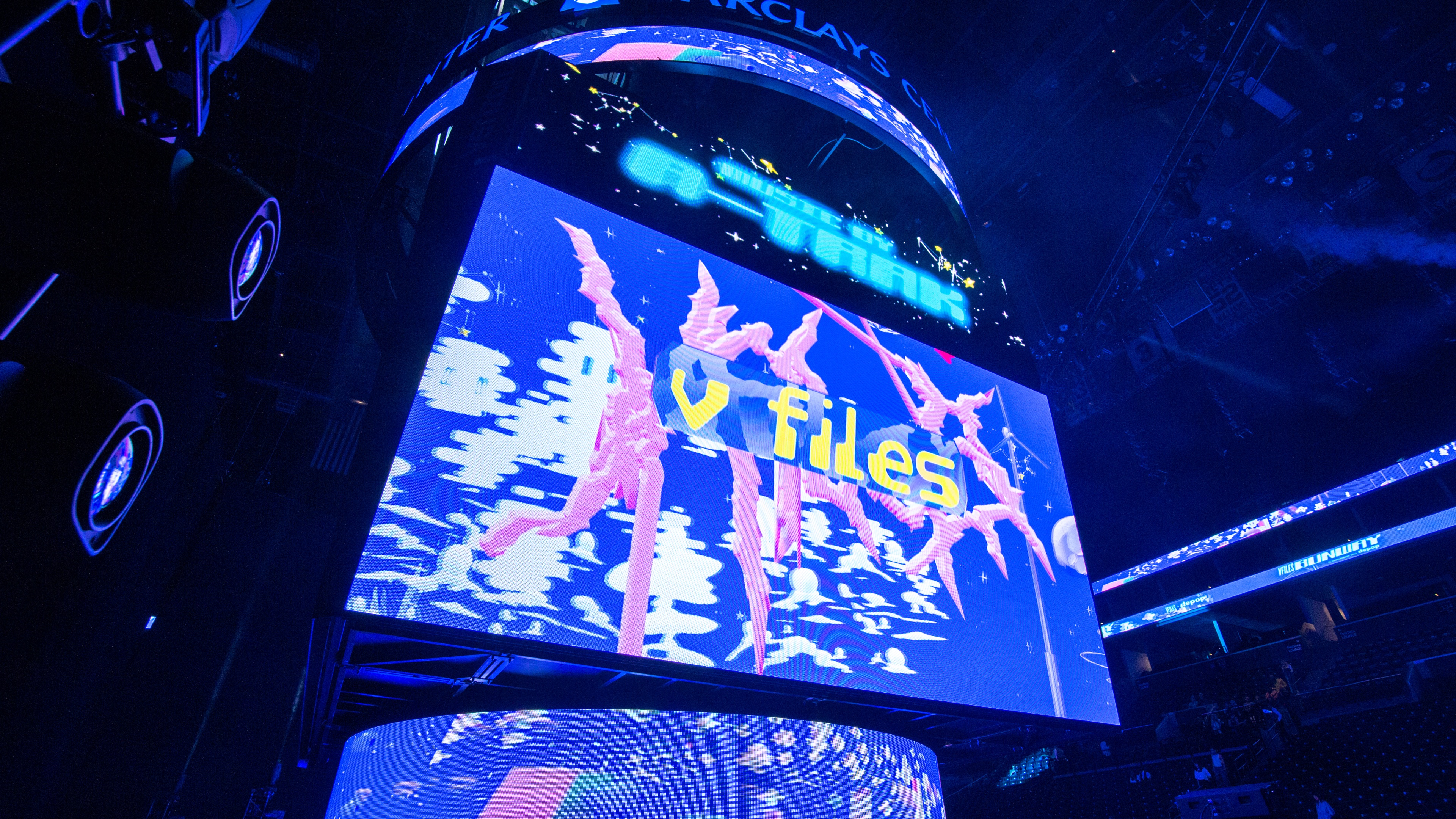 Large LED screen that says V Files in yellow letters