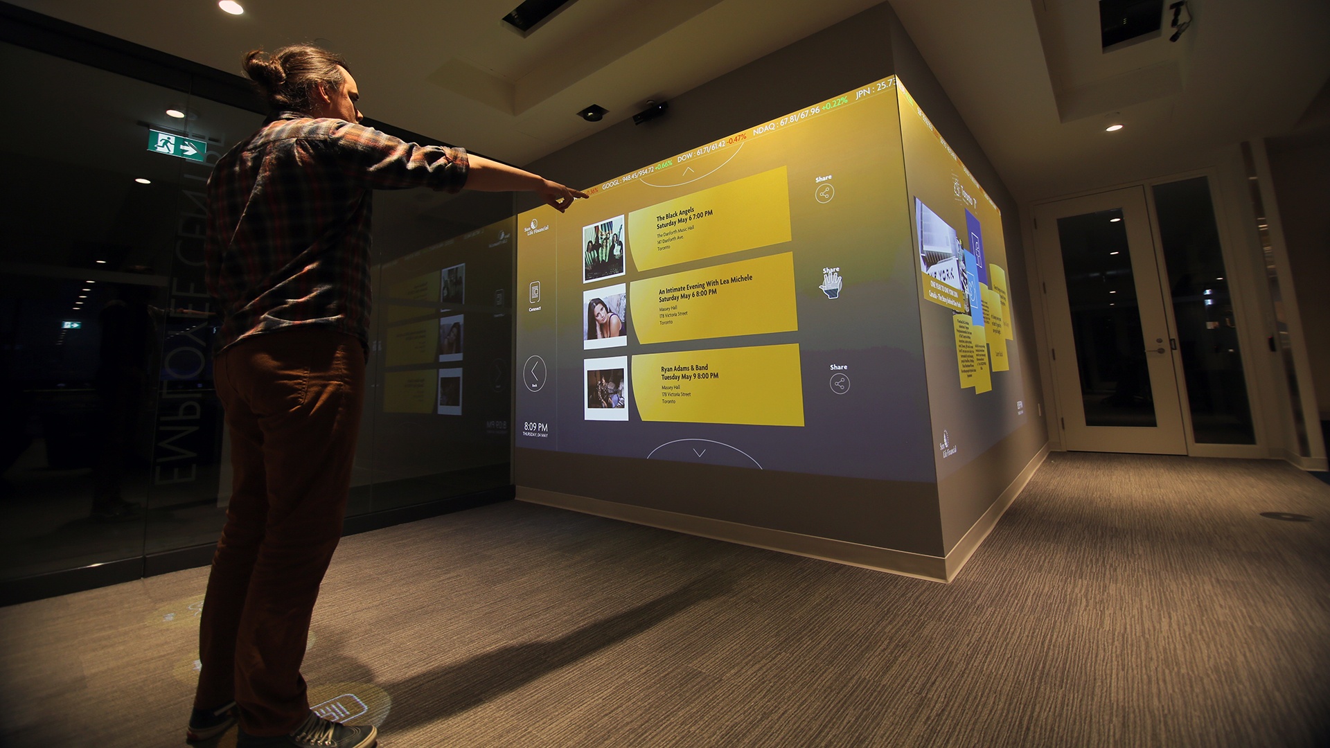Man interacting with LED screen display