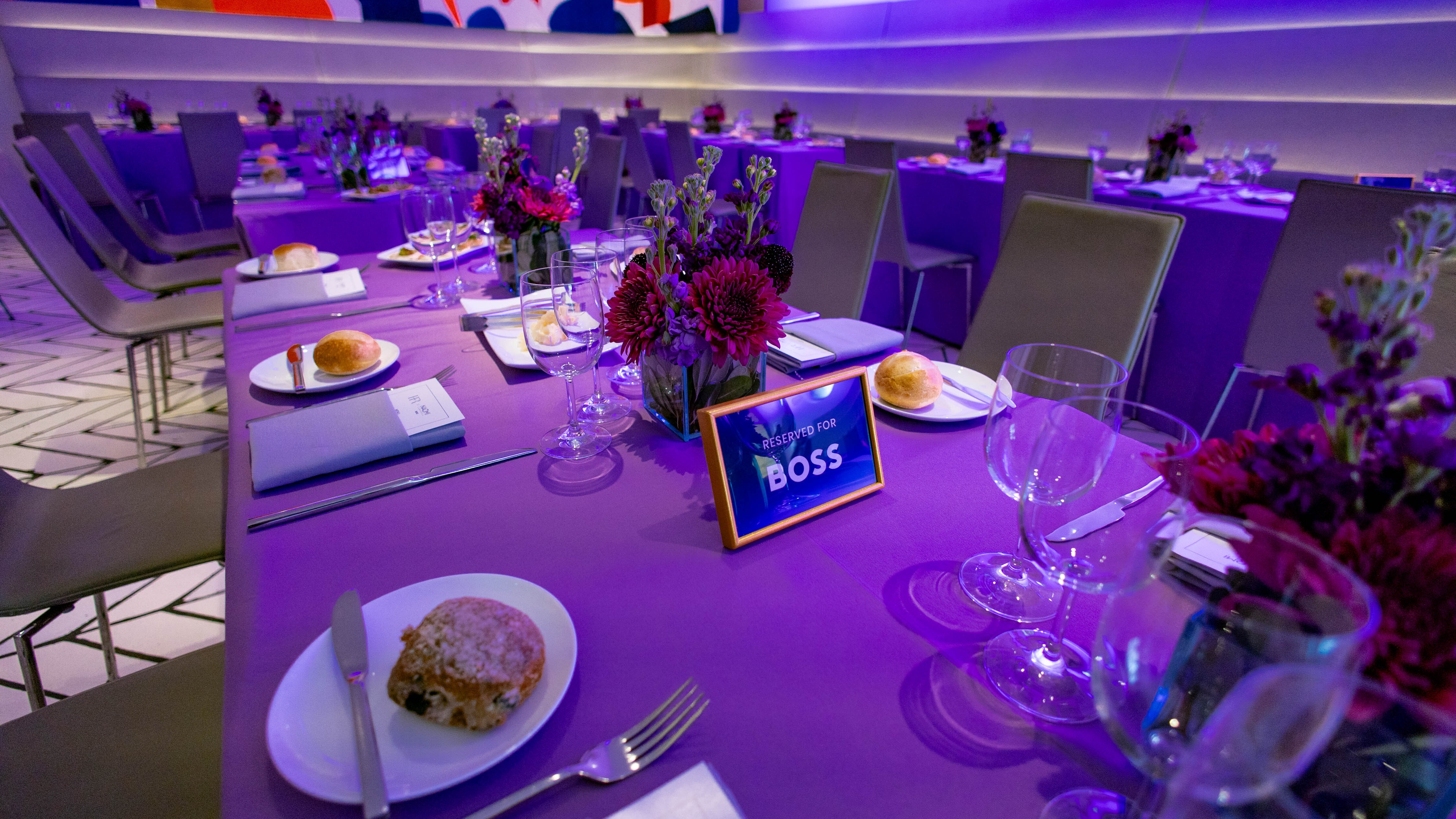 Elegant table setting with BOSS sign on table