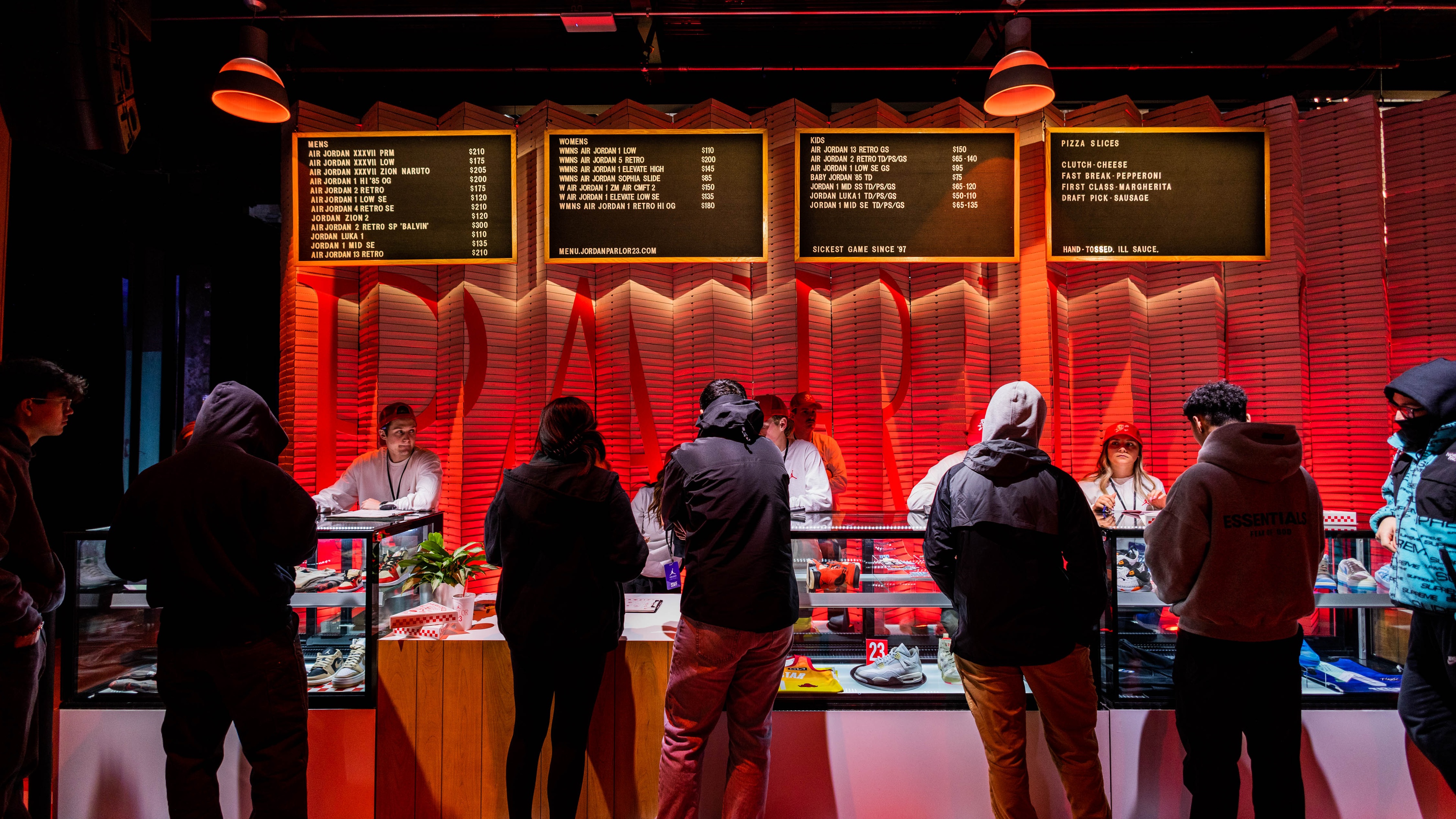 Jordan Parlor23 guests ordering at food counter with red lighting in background