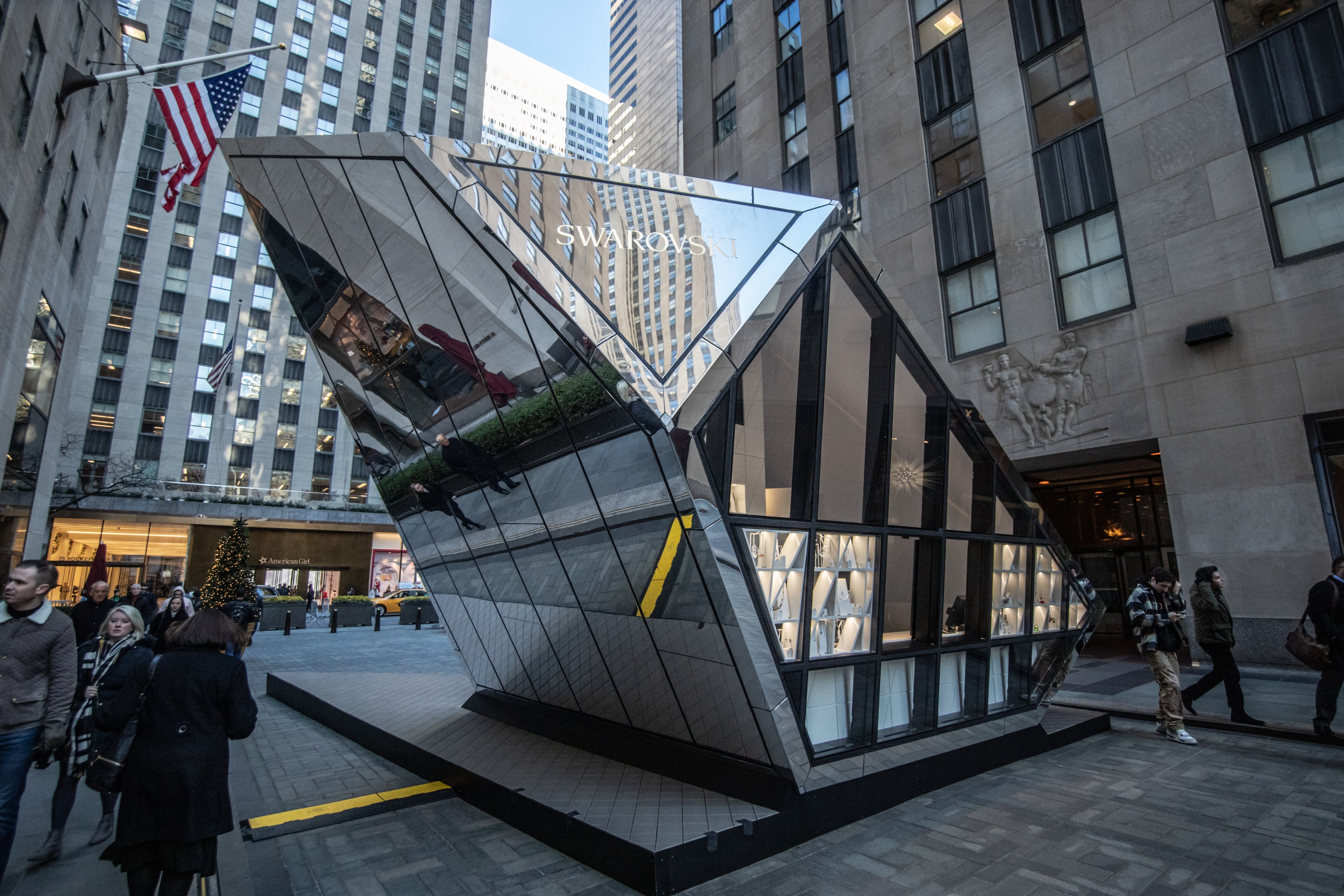 Swarovski glass pop up boutique with guests around it