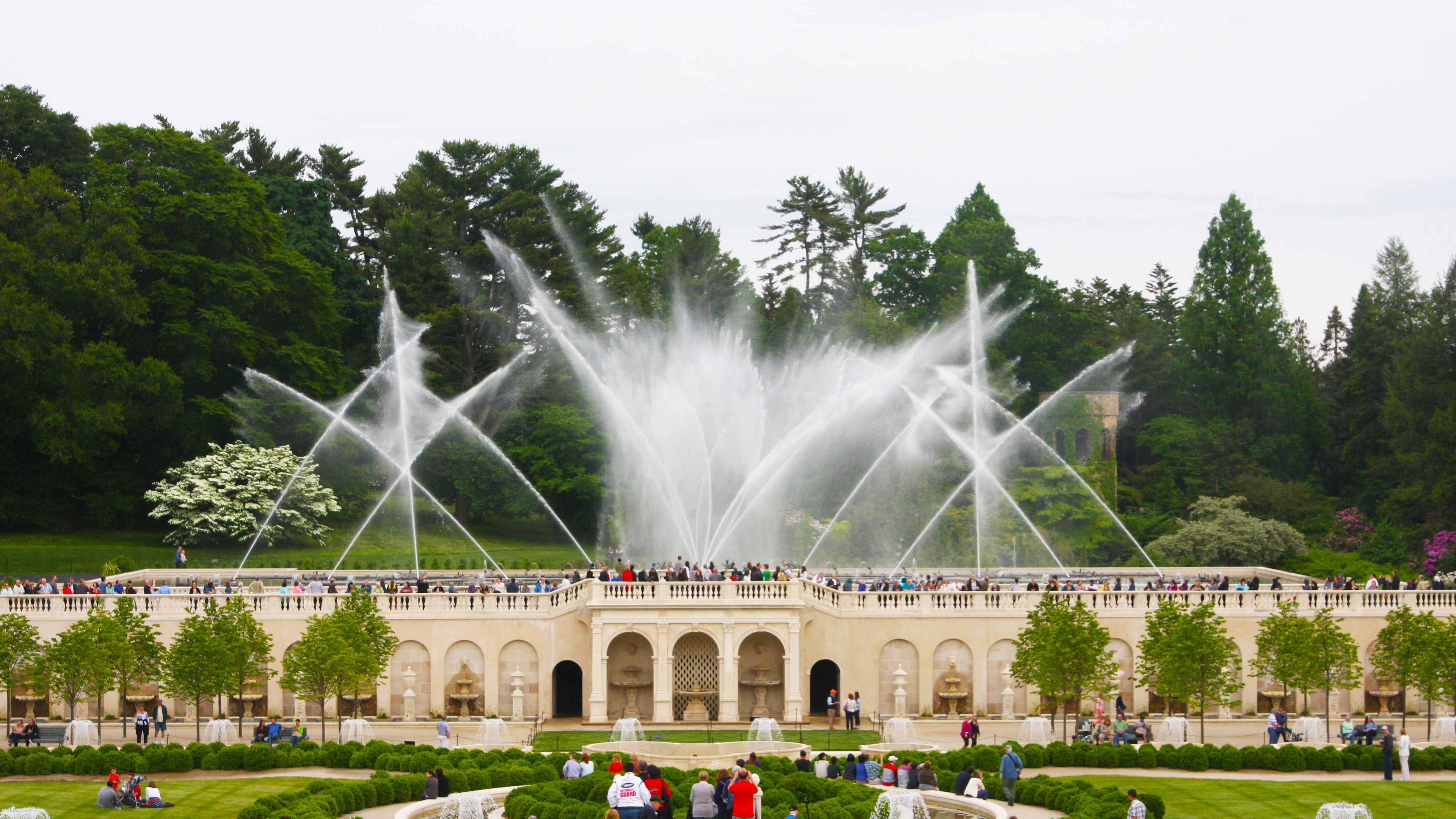 Night time water light show display with green lights