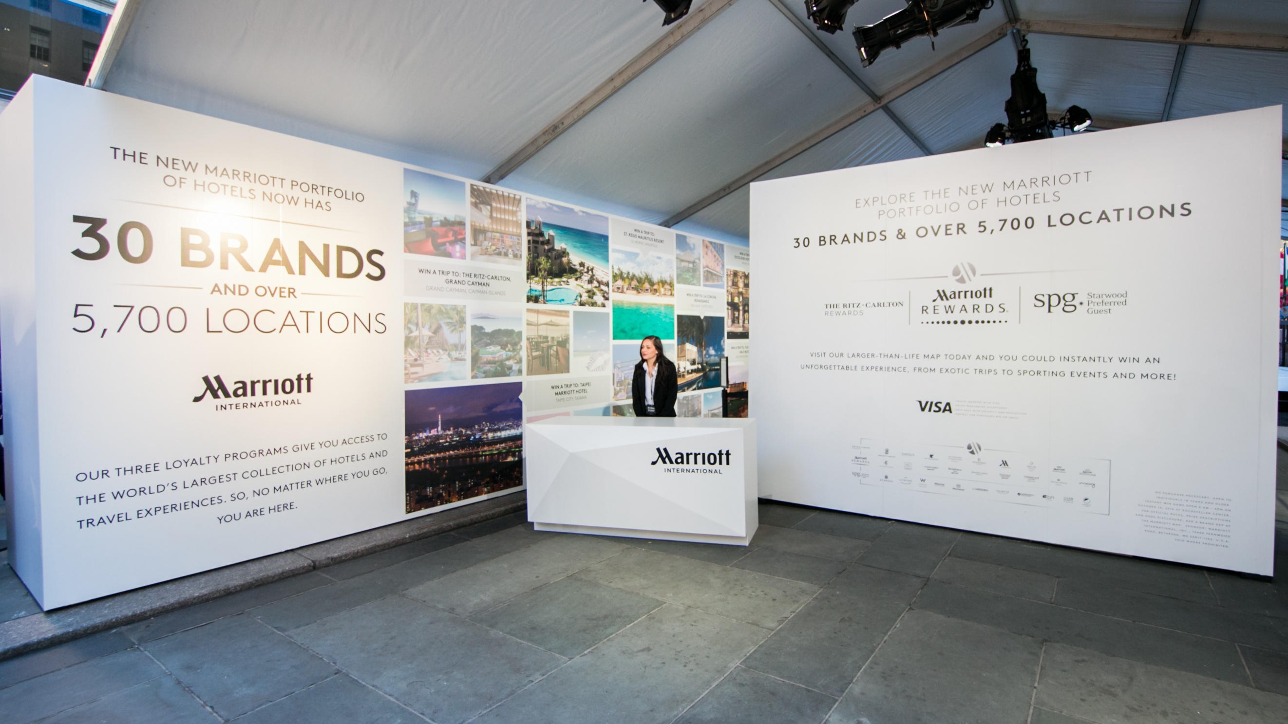 Big white walls explaining Marriott locations with woman standing in front