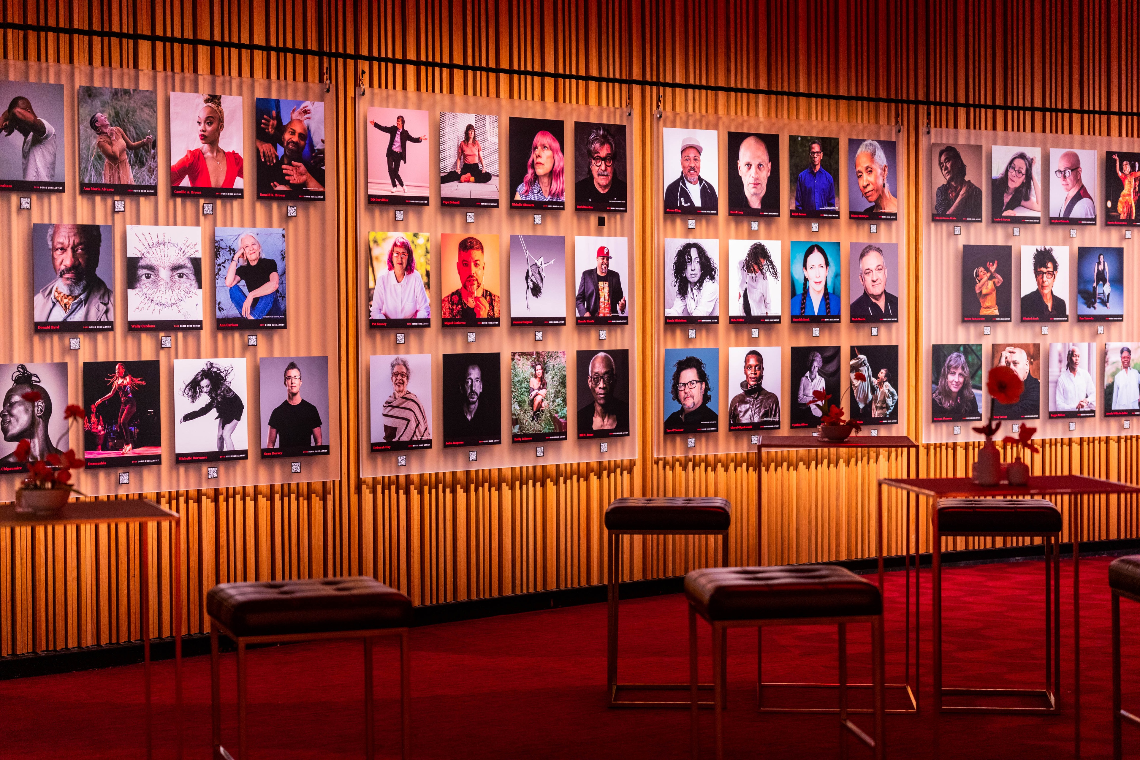 Doris Duke Artist Awards 10th Anniversary Celebration wooden wall featuring a photographic profiles grid of performers in contemporary dance, jazz, and theater