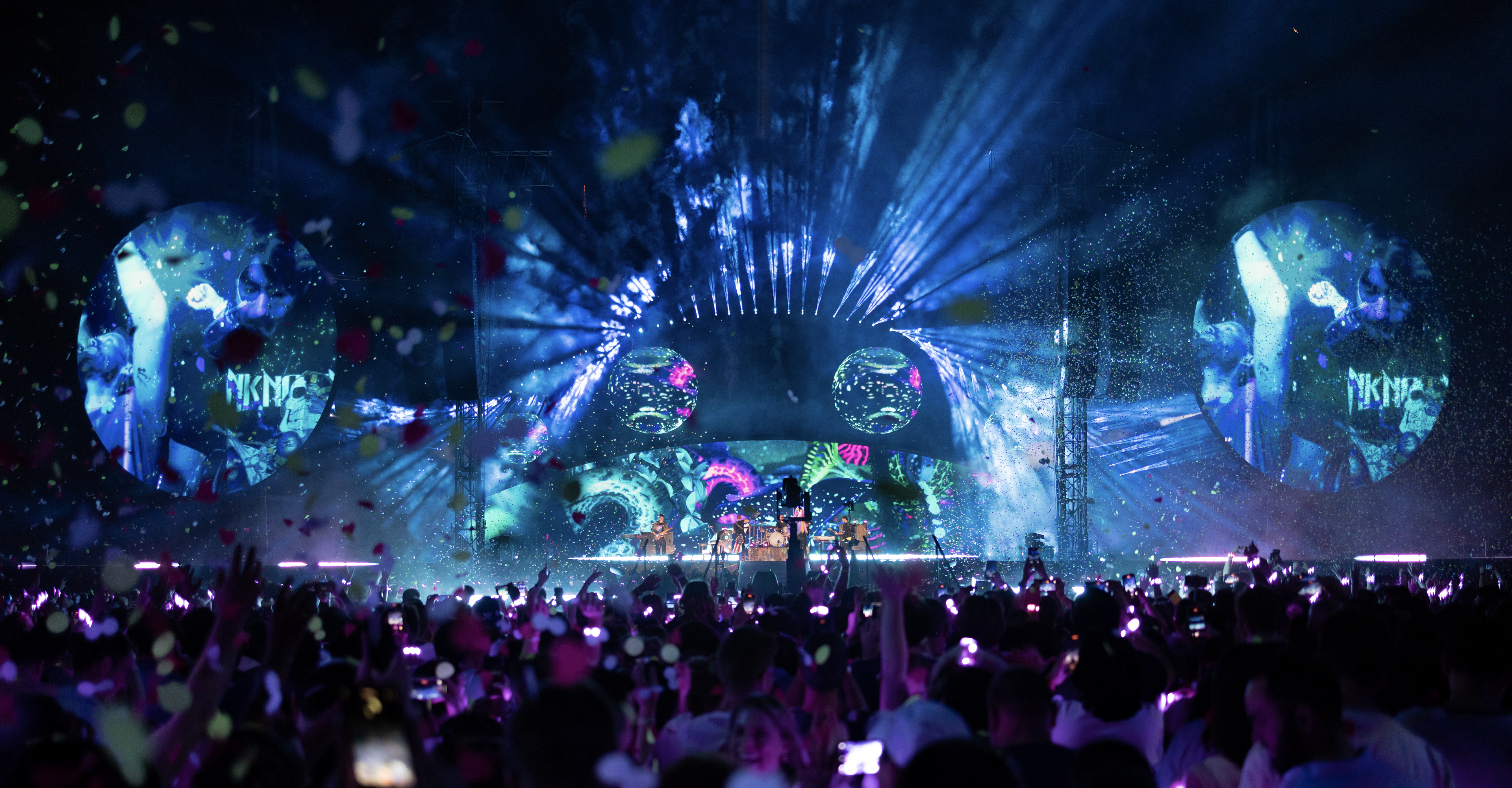 Coldplay Music of Spheres stage with blue lights and visuals