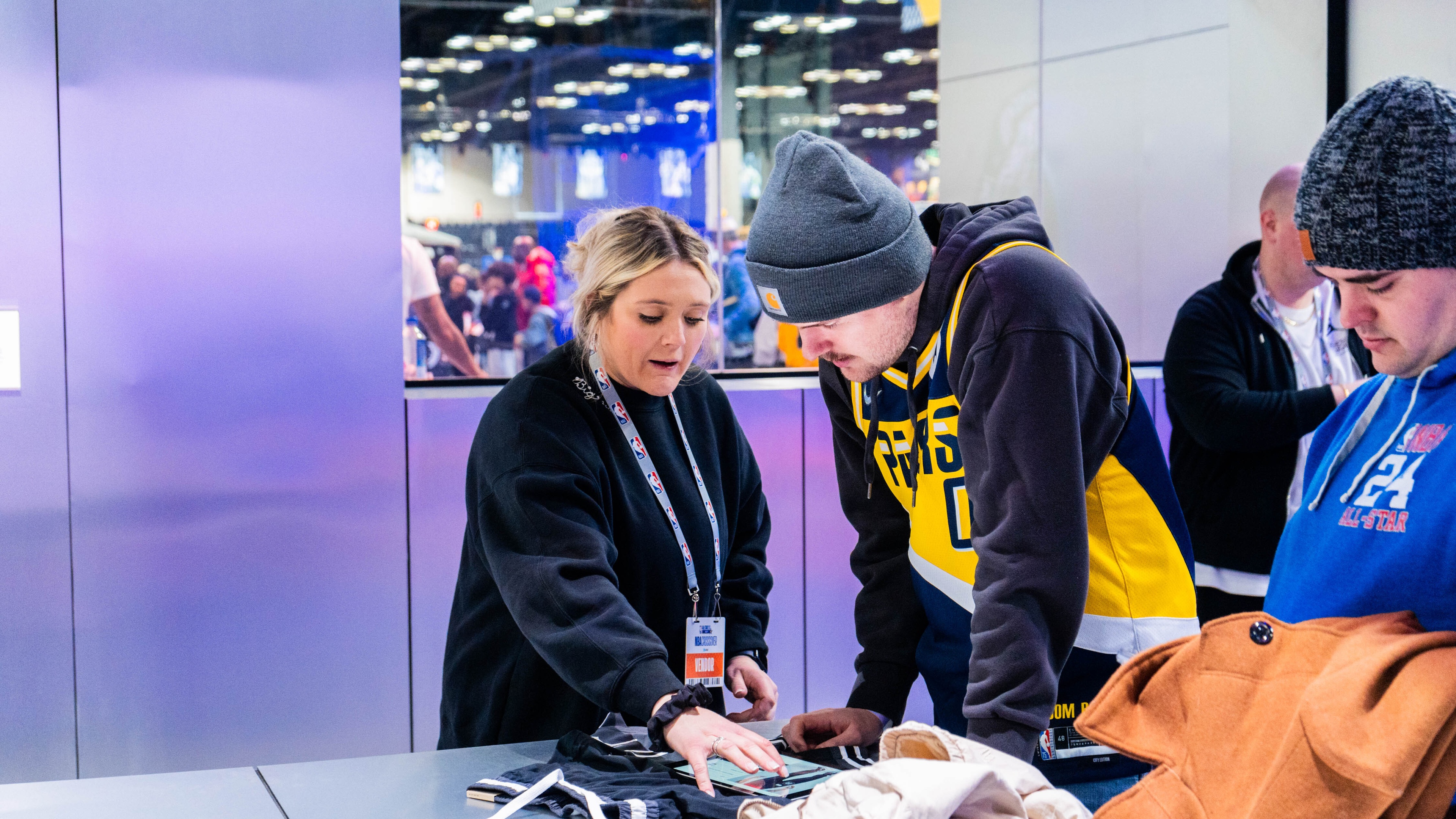 woman interacting with customer using tablet
