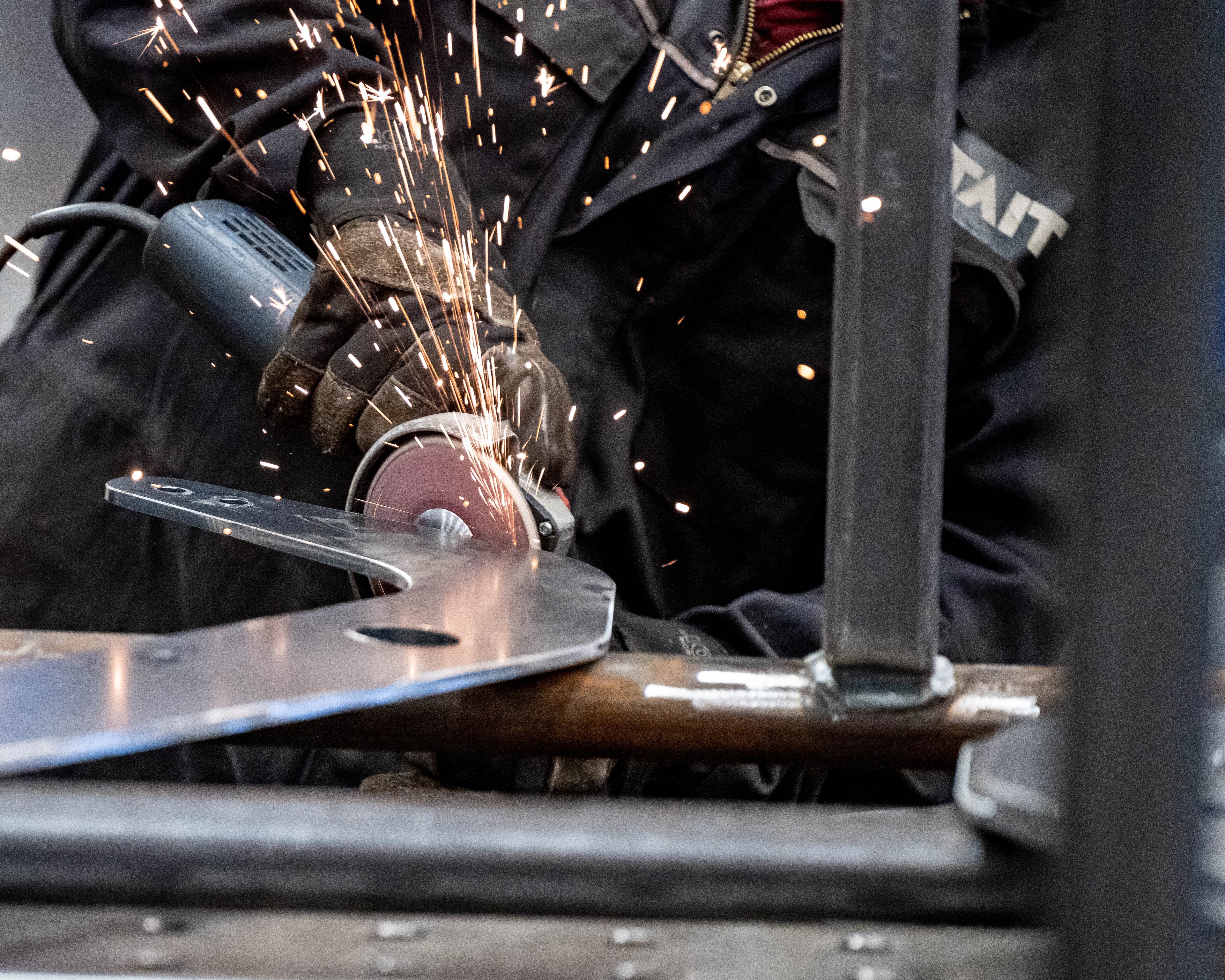 sparks flying as machine cuts through metal