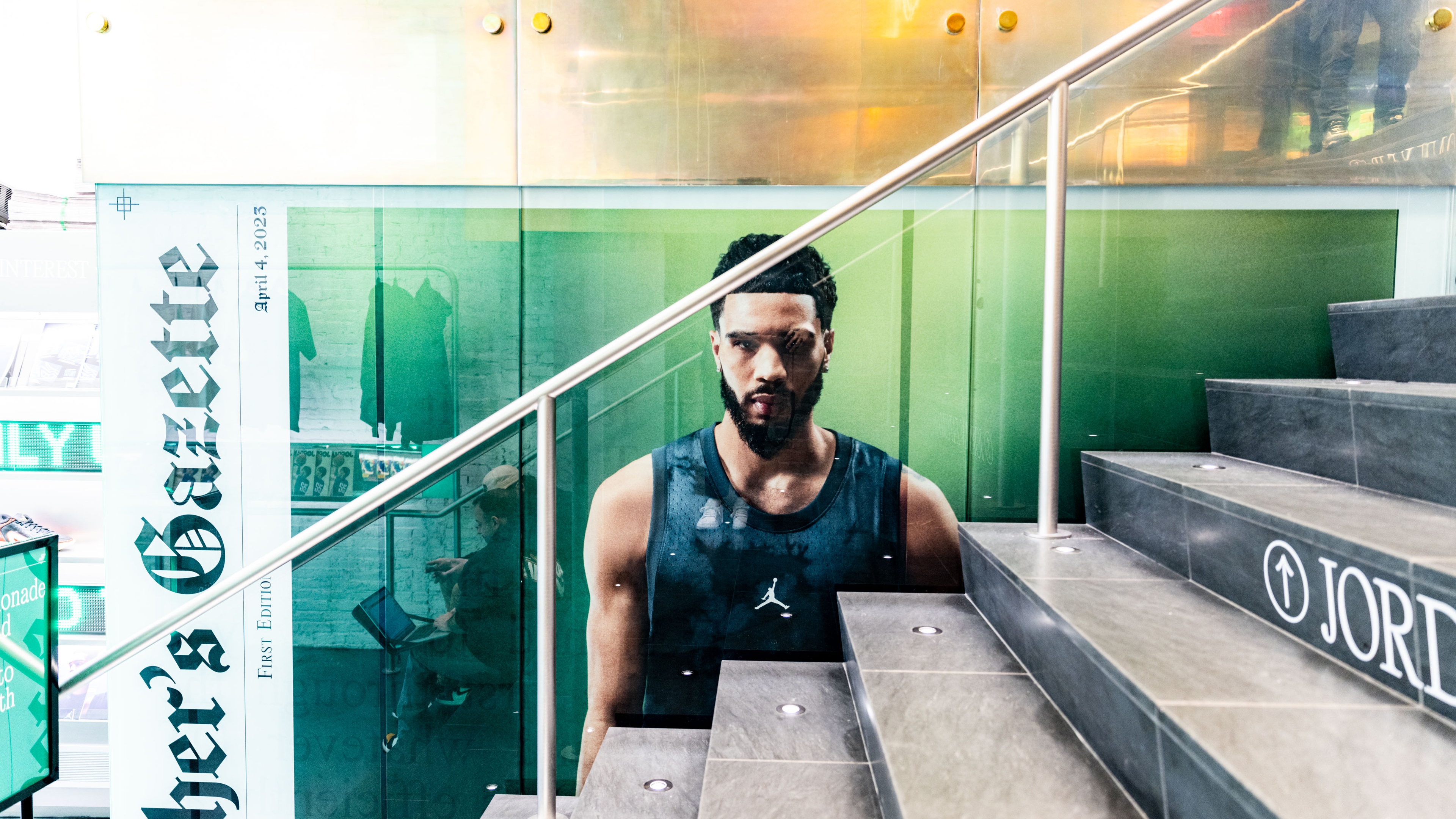 Basketball player printed onto side of staircase of Nike brand experience