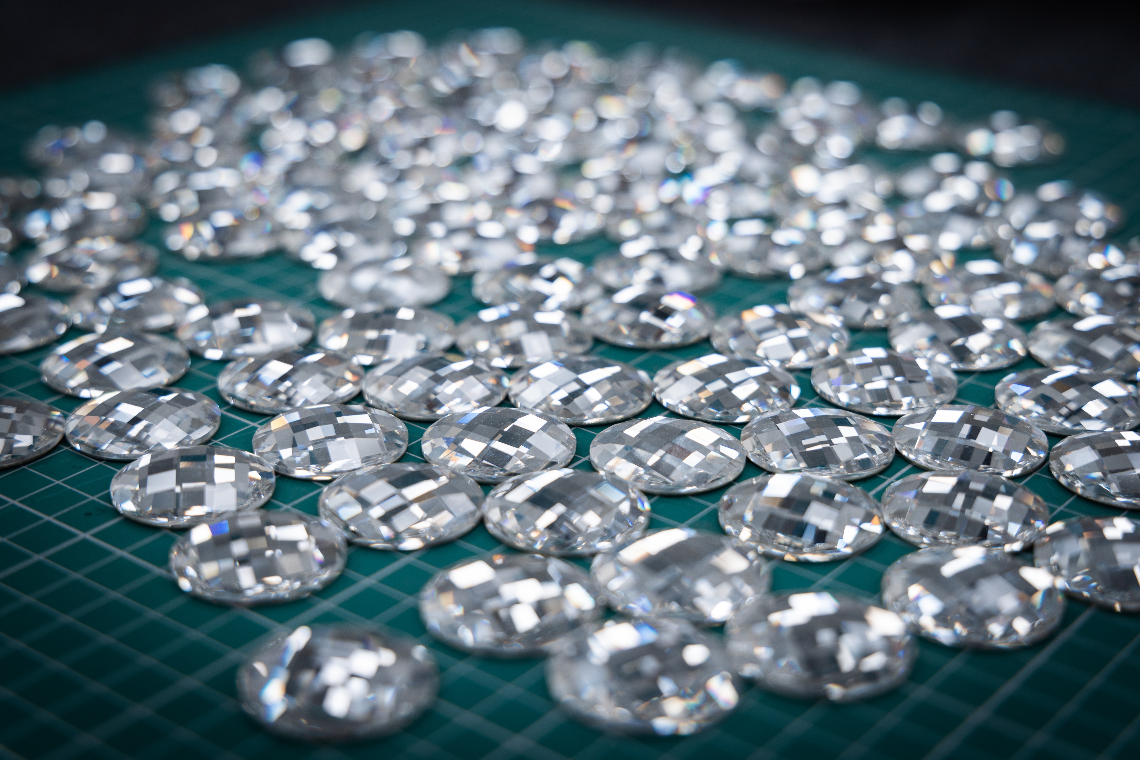 Many Swarovski crystals laid out on a surface