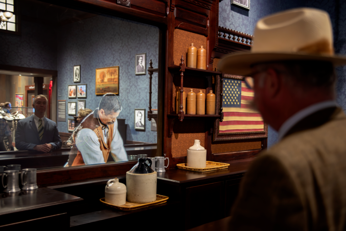 Museum saloon replica with an interactive bartender in the mirror of the bar