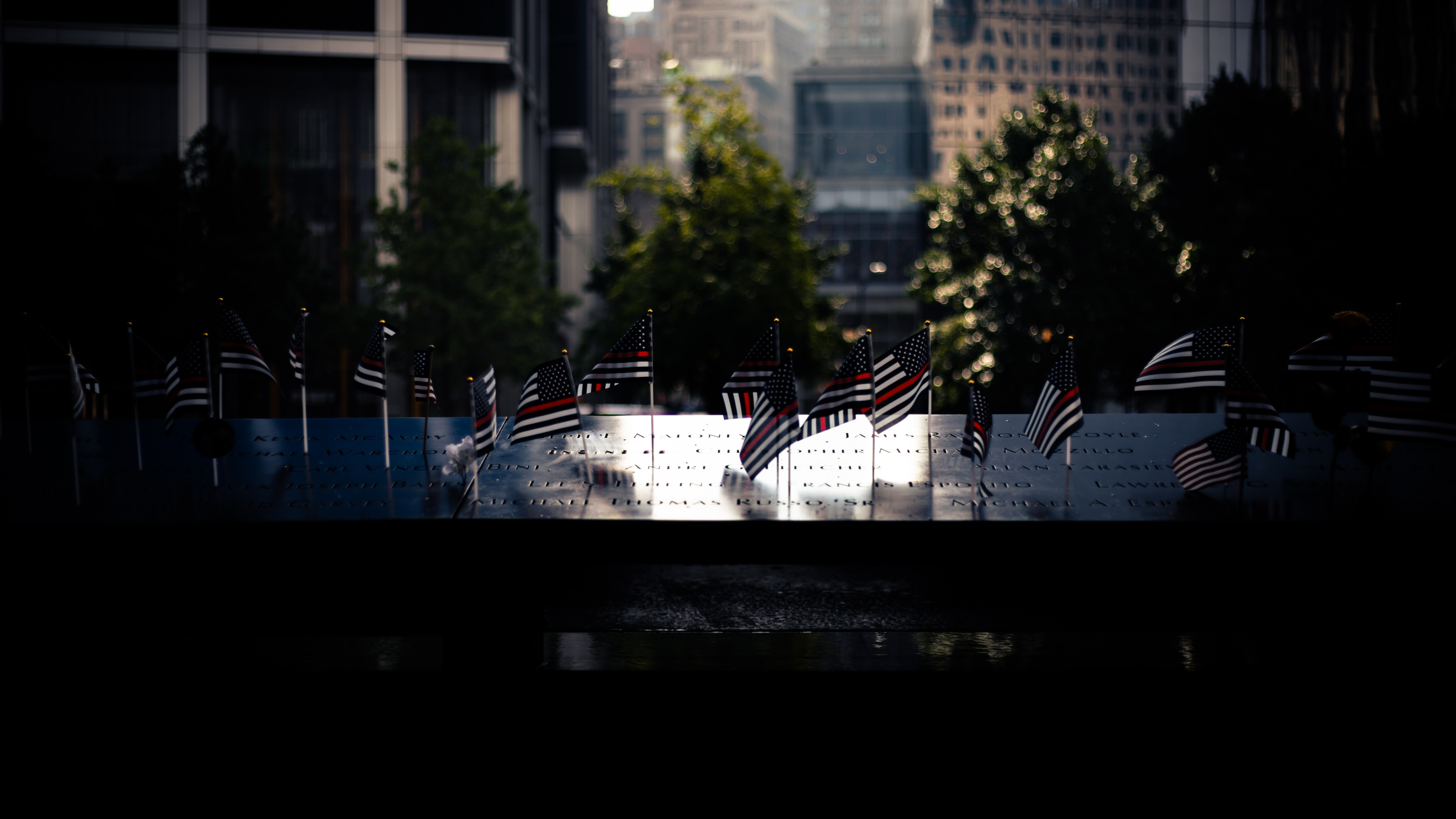 Shadowed shot of American flags at 9/11 memorial