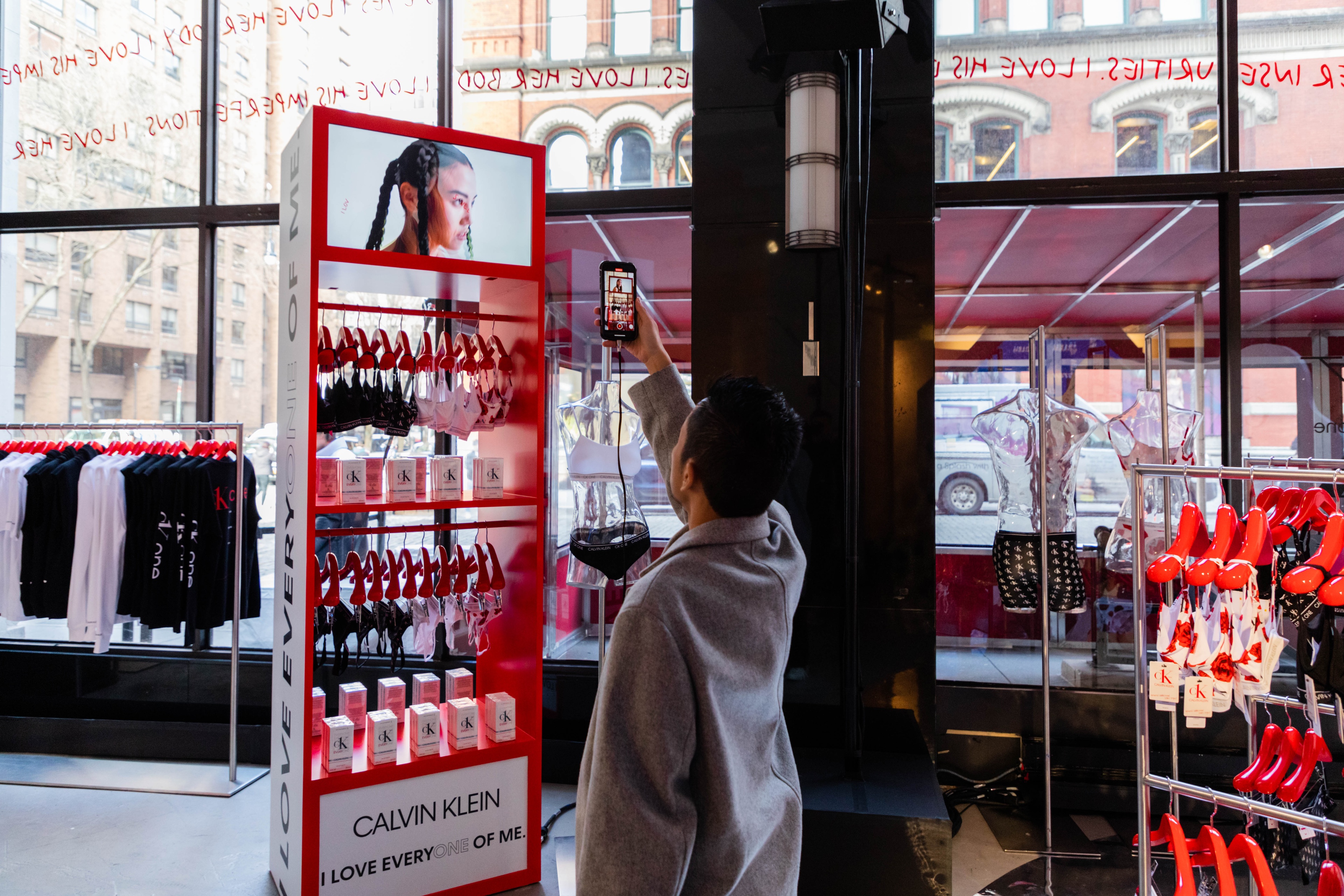 Man taking a picture of product