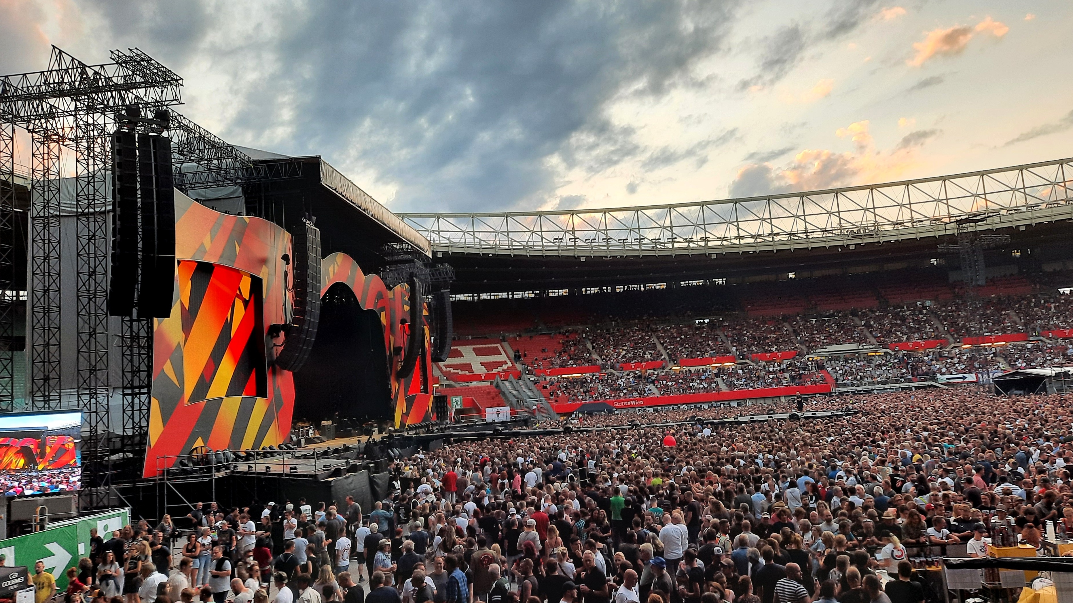 Huge stage set up in football stadium with crowd of people