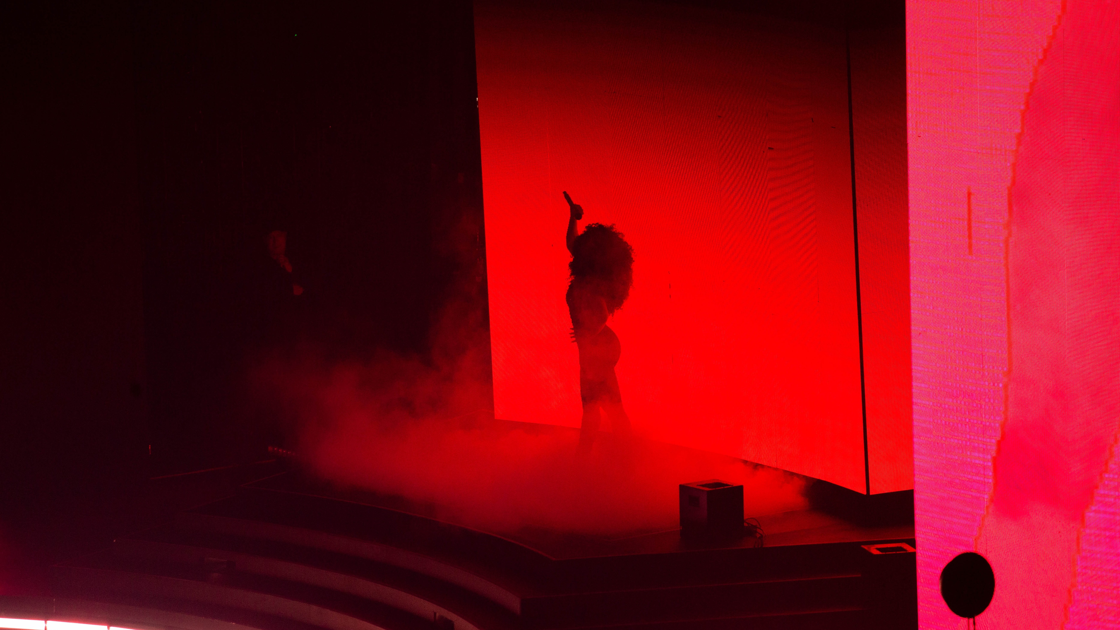Megan The Stallion on stage with red lighting