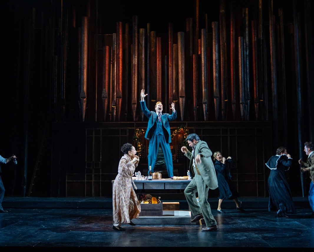 Ensemble of performers dancing on stage