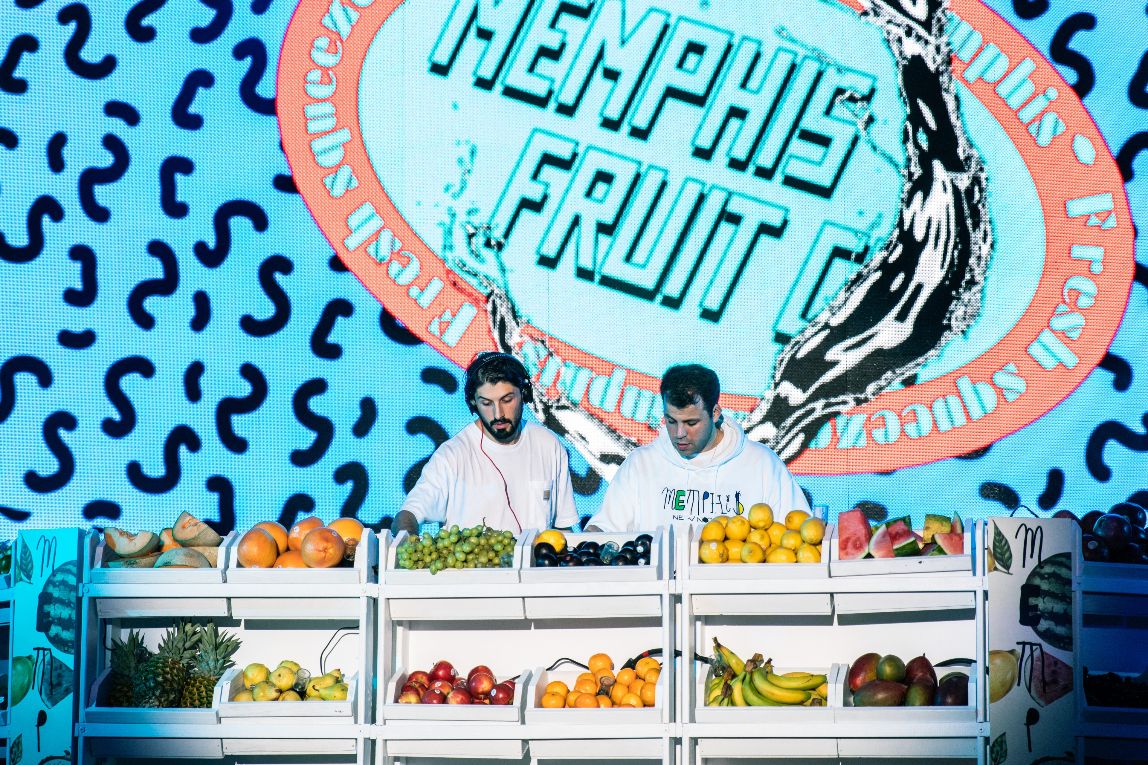 Food vendor with fresh produce in front of them