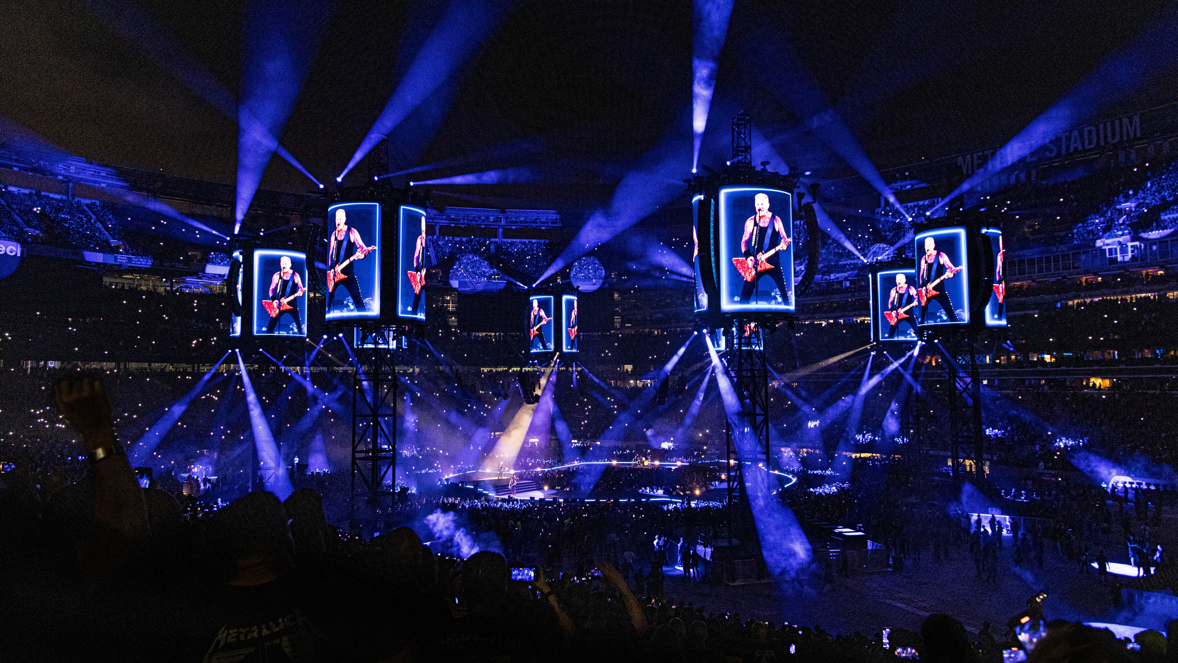 Metallica M72 Tour stage lit up blue with LED screens showing band