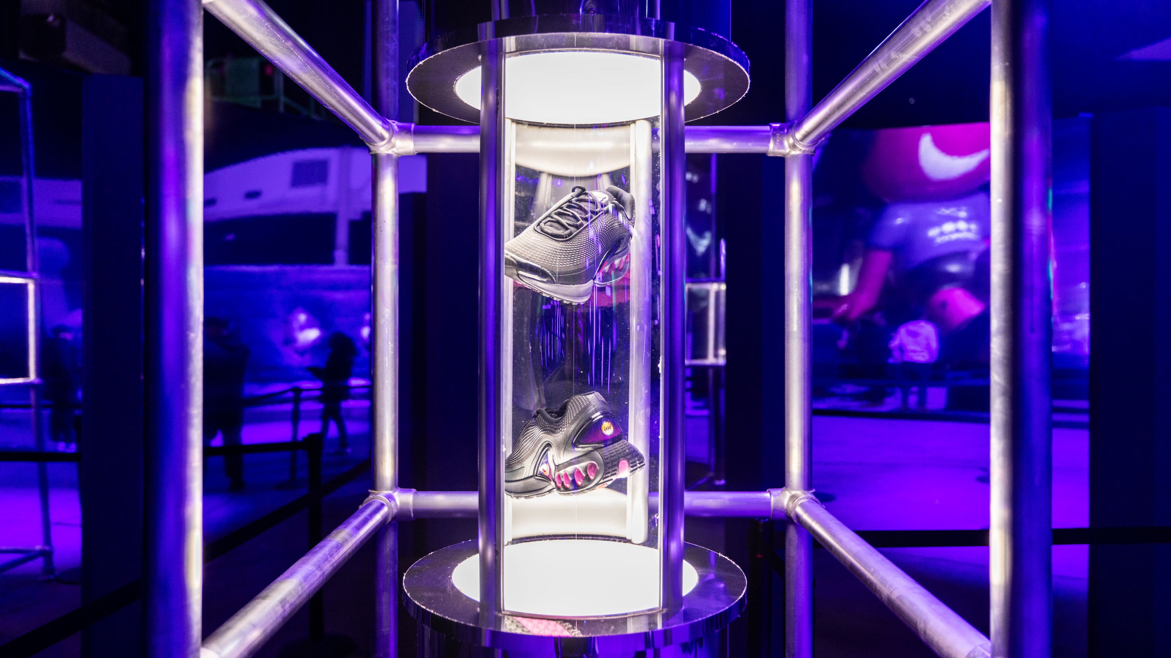 Shoe displayed in lit up glass enclosure