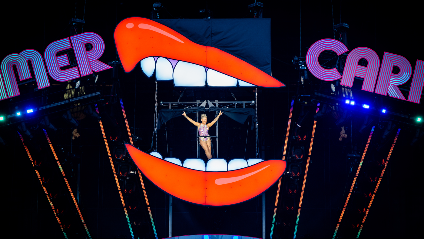 P!nk performing inside a mouth structure high above the stage