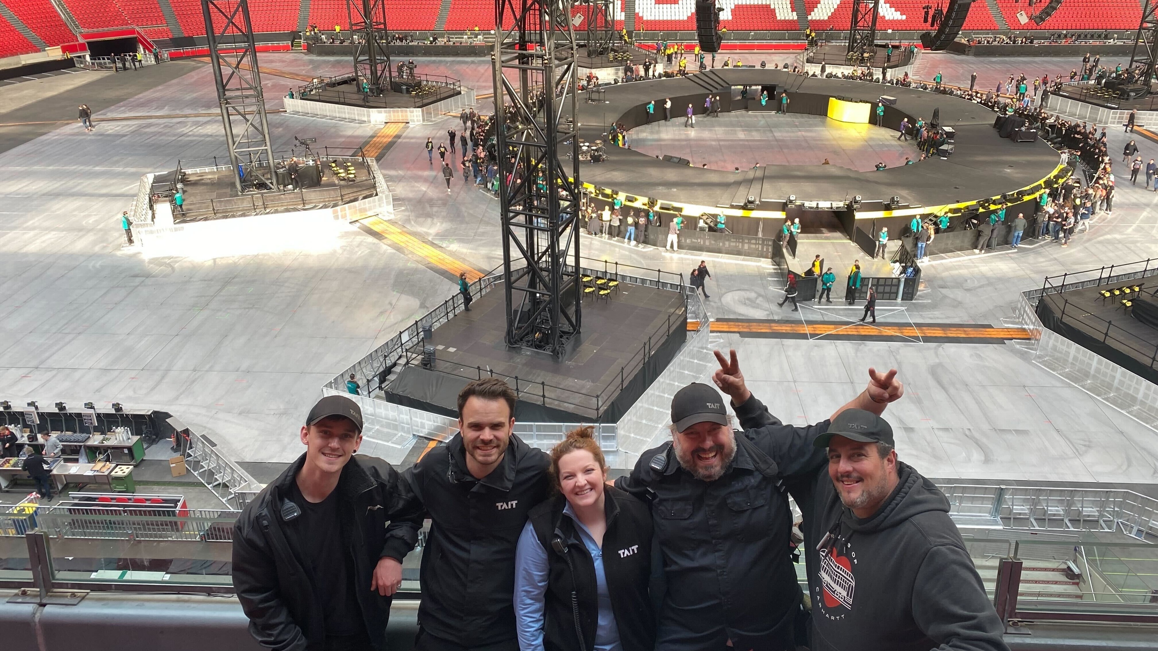 Metallica M72 stage lit up blue and purple surrounded by crowd