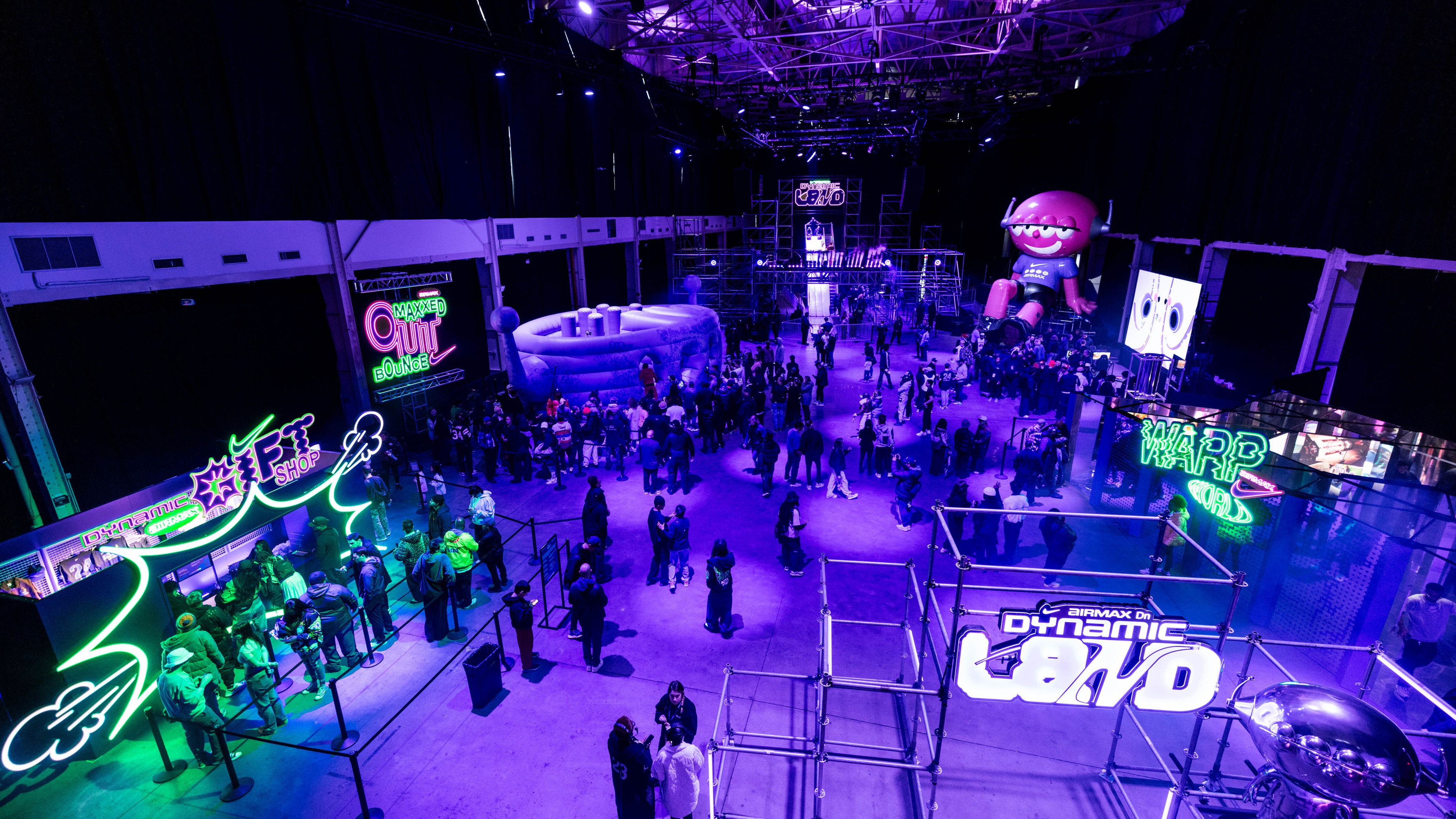 Large warehouse with black lights and purple accents