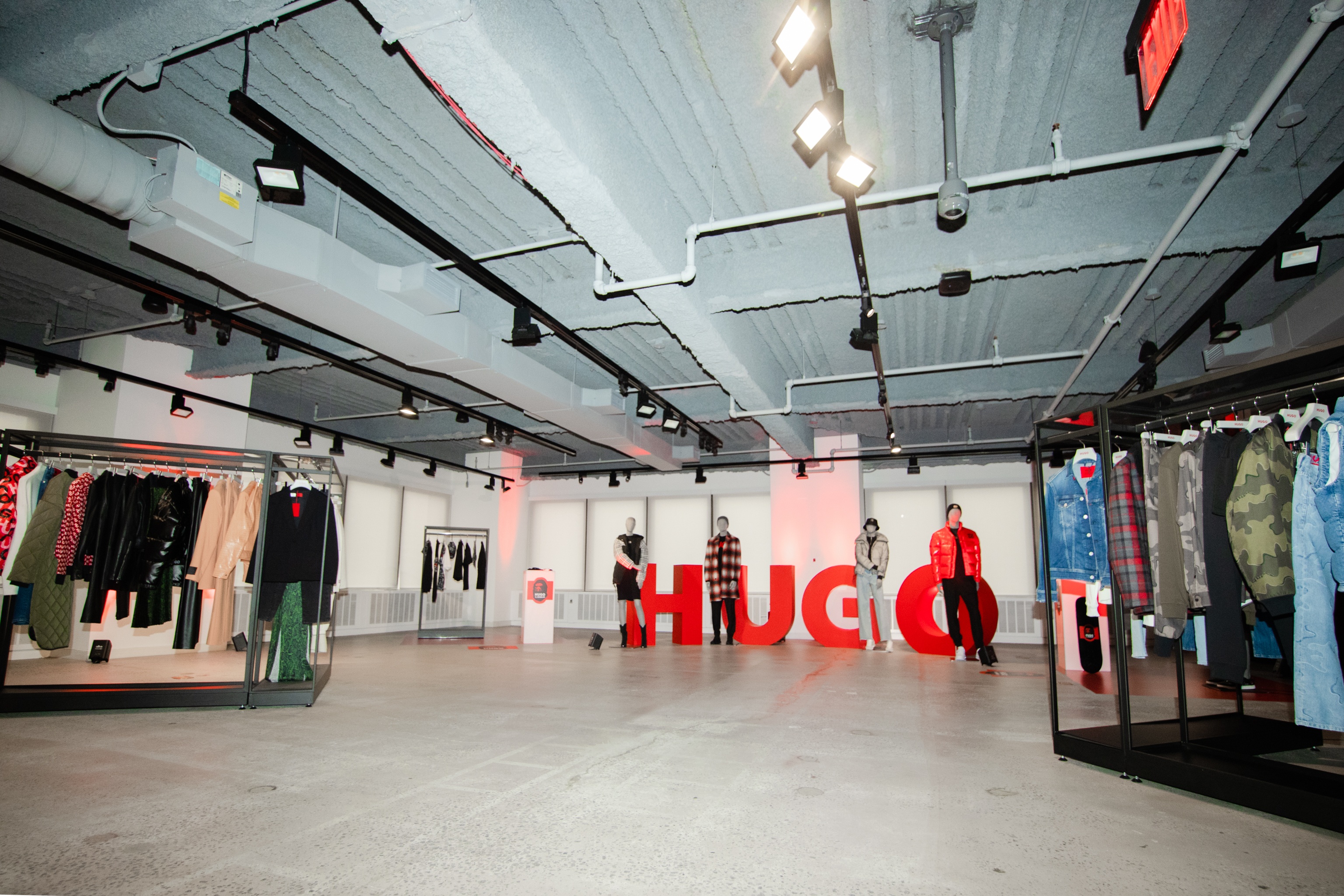 HUGO in big red letters in store area with merchandise