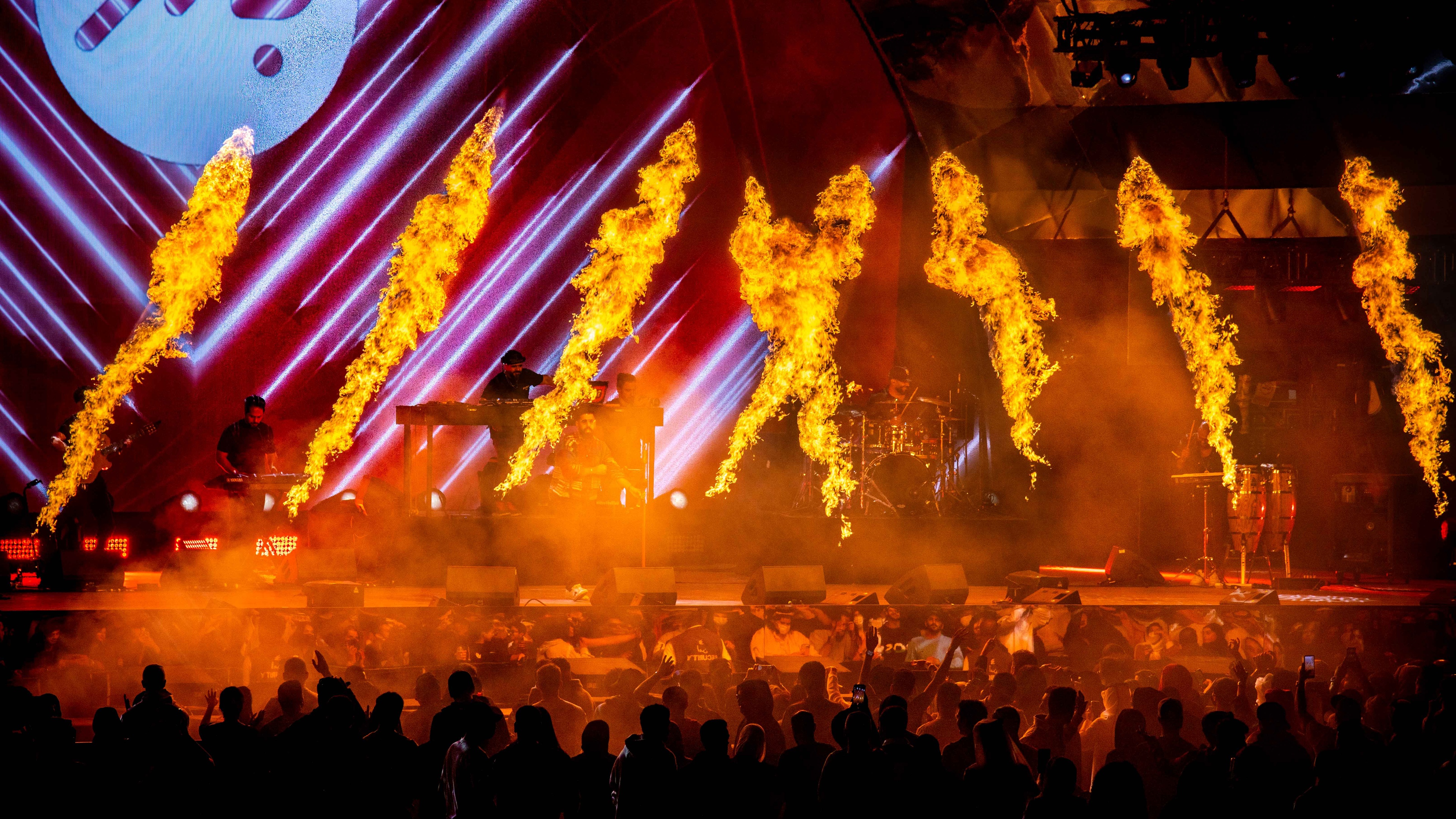 Aravia MDLBEAST view of the stage, multiple fire sparks coming off the stage as musicians perform