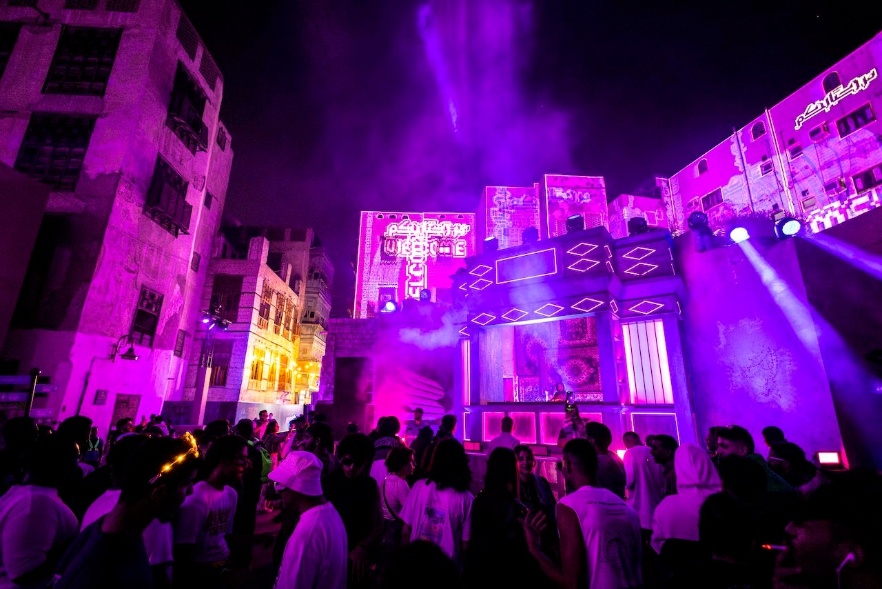 Crowded street with projection mapping on buildings