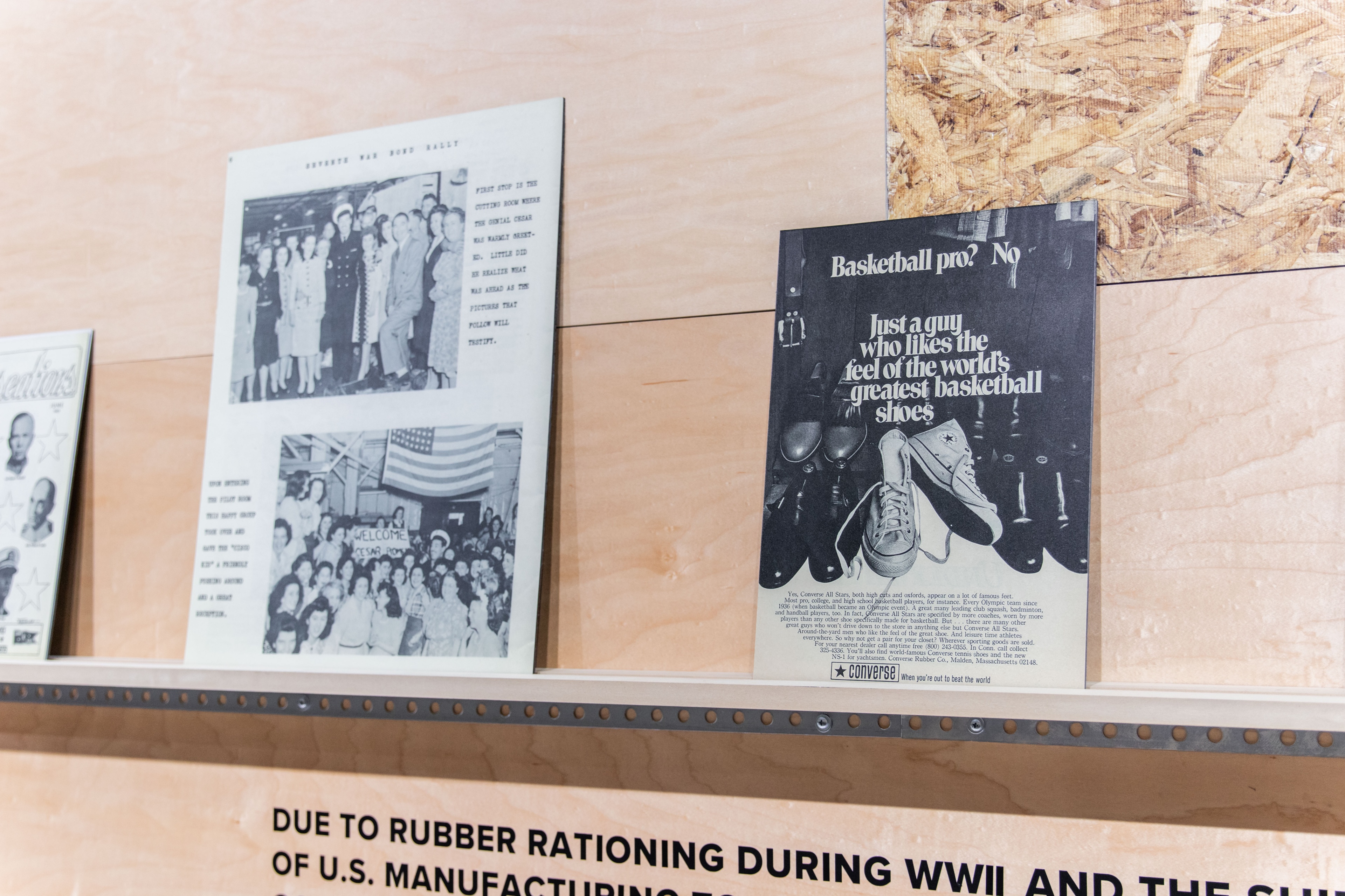 Close up shot of books that are displayed on the wooden wall