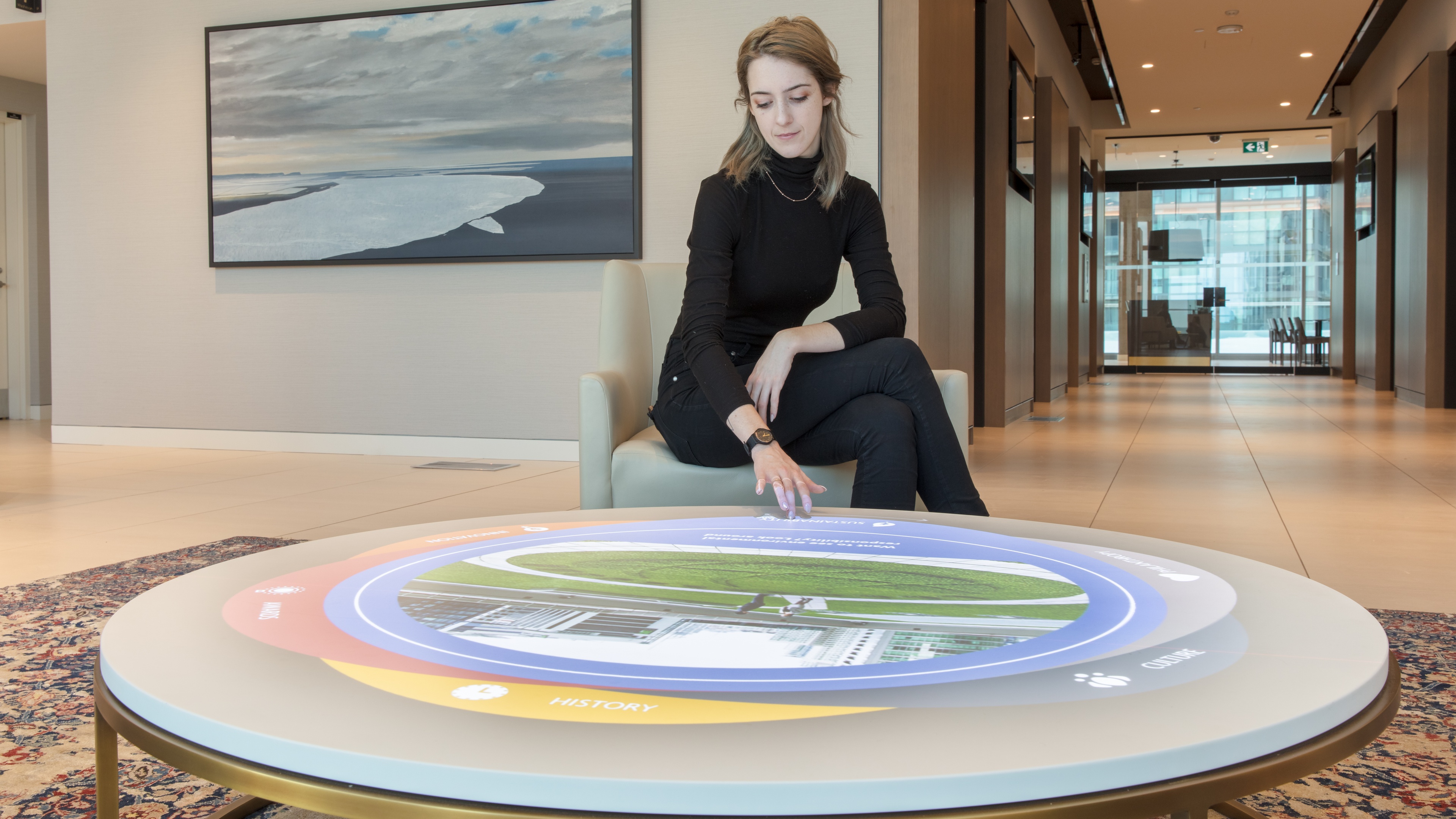 Blonde woman interacting with table