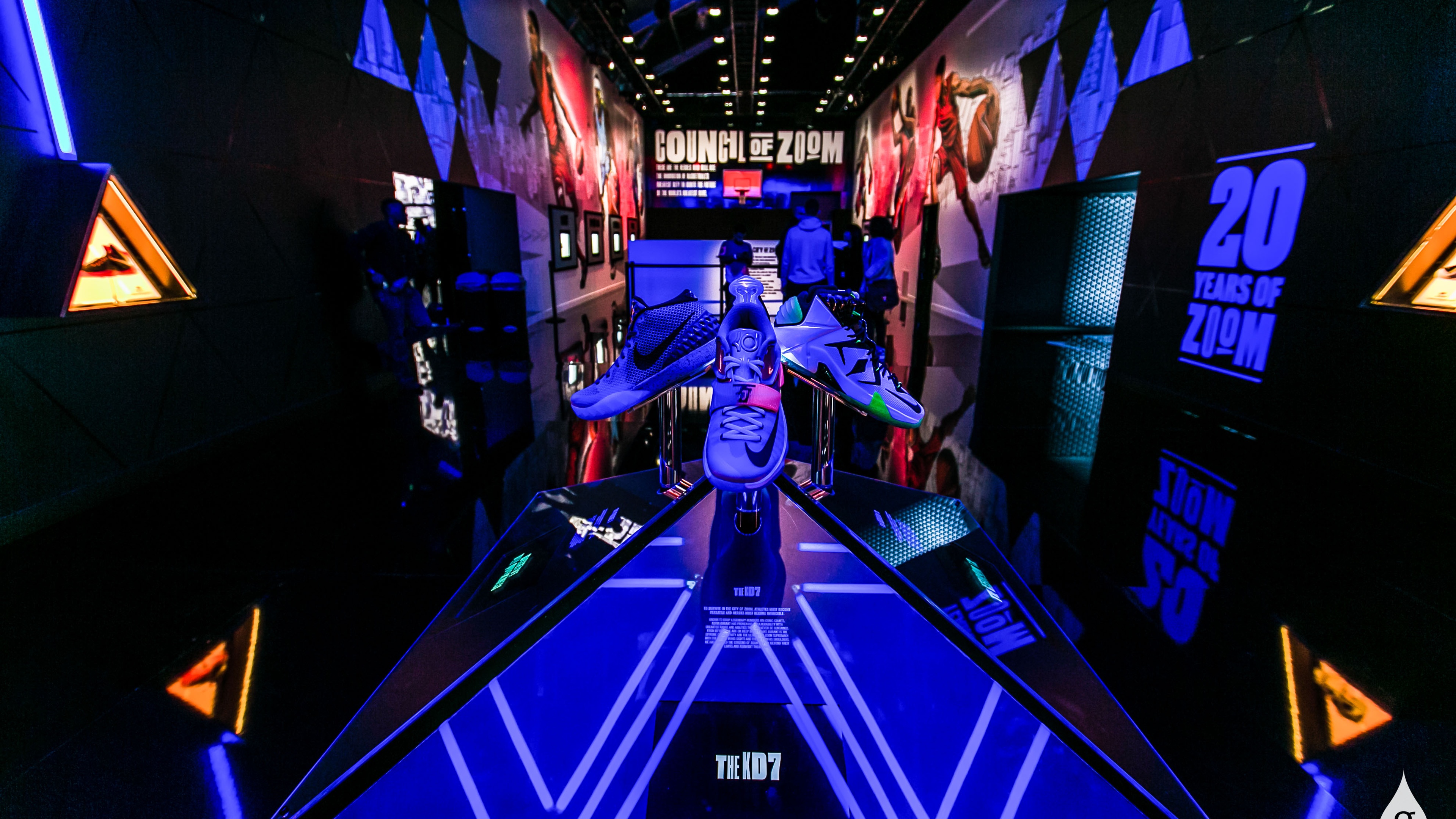 Basketball shoes displayed in blue lighting
