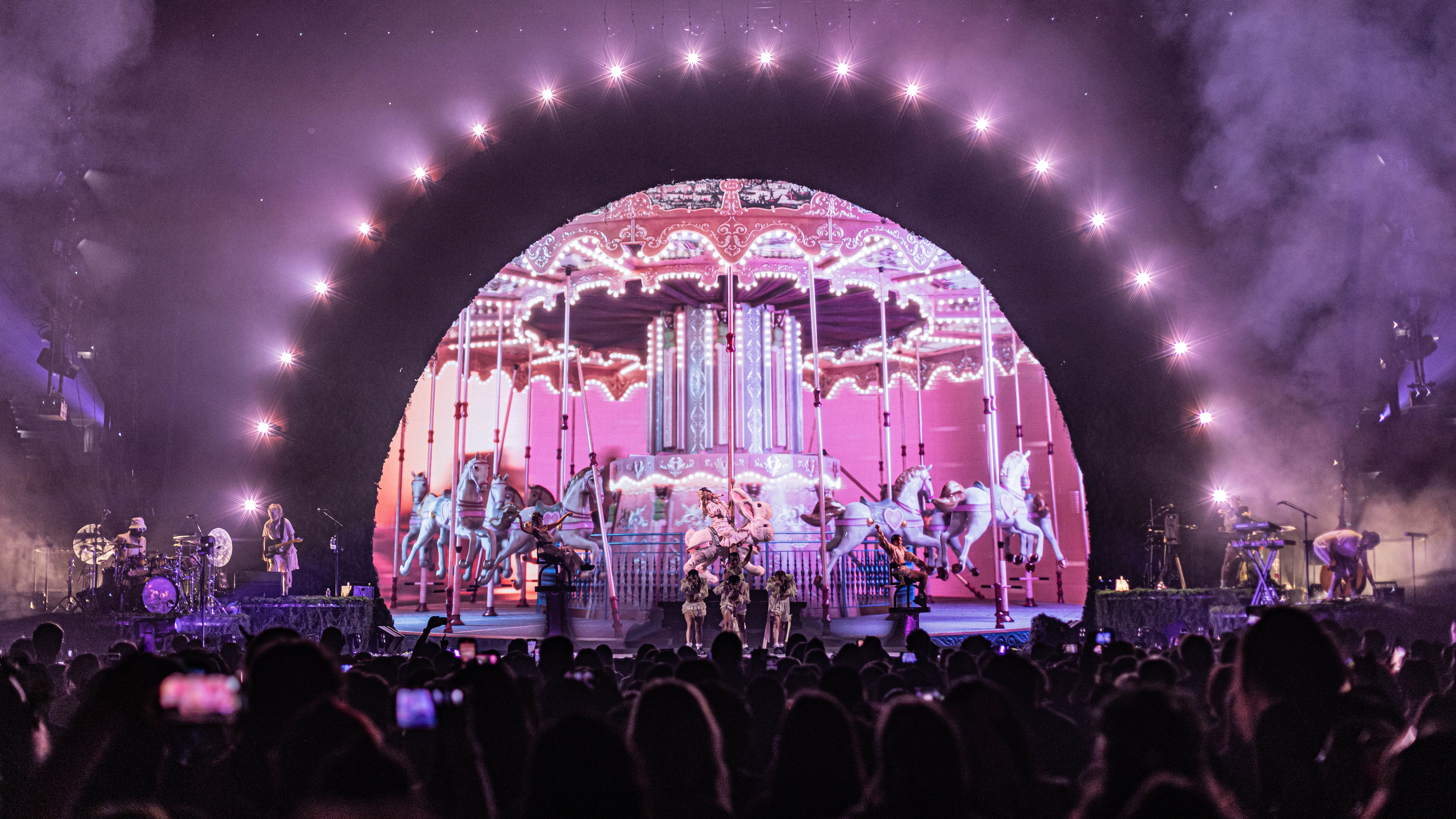 Stage with carousel and pink lighting