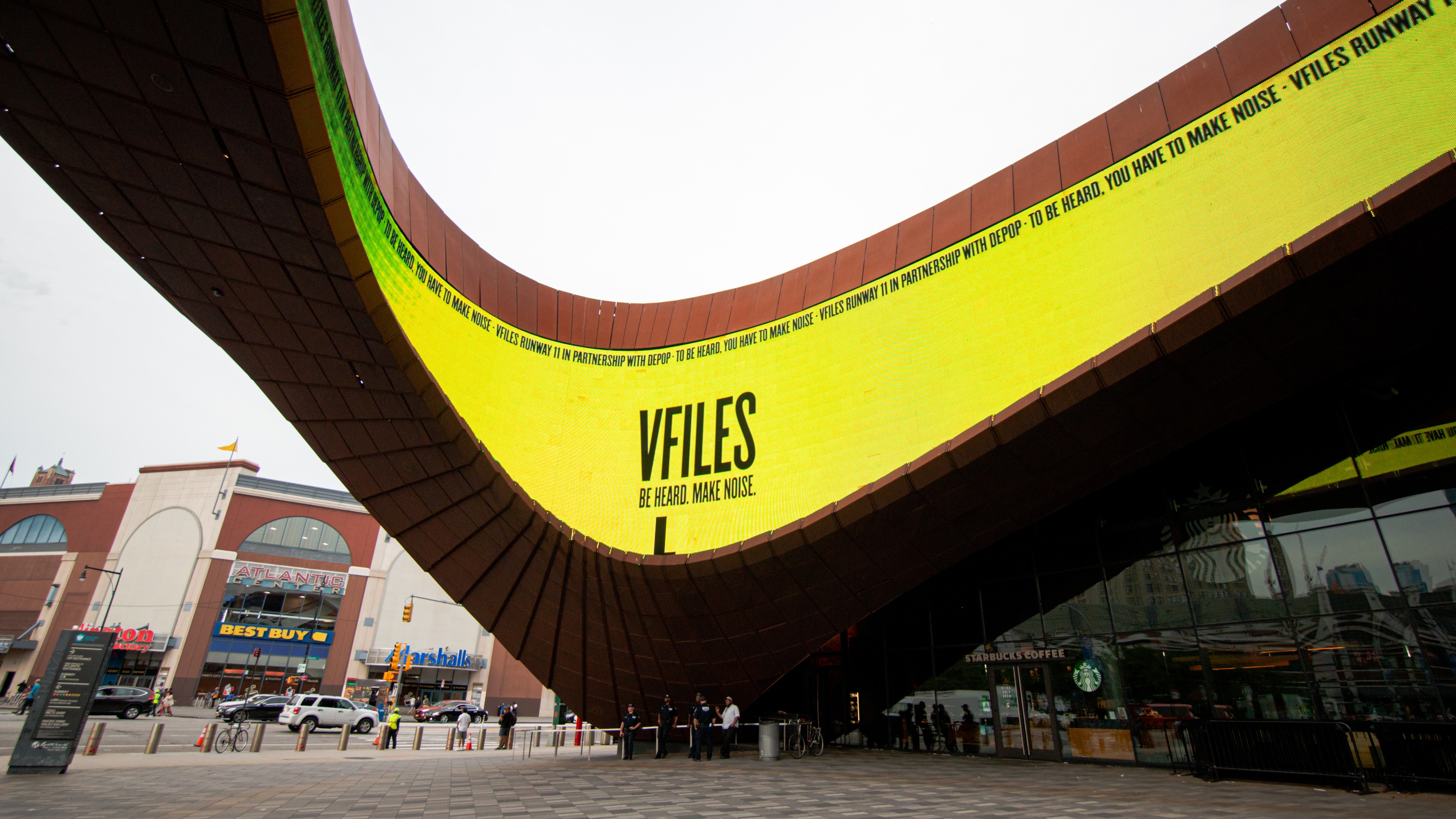 Large neon yellow outdoor architecture that says VFILES on it