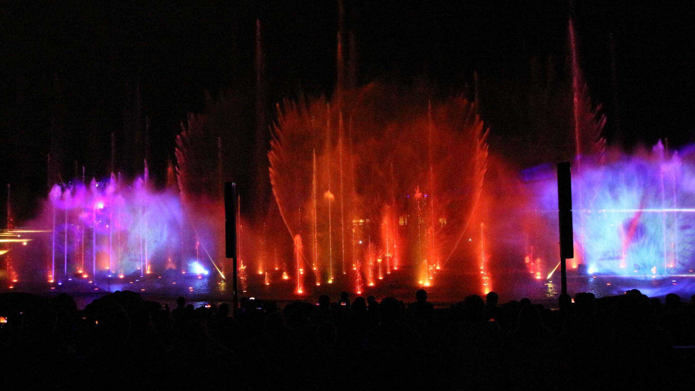 Light show at night with red and pink lights