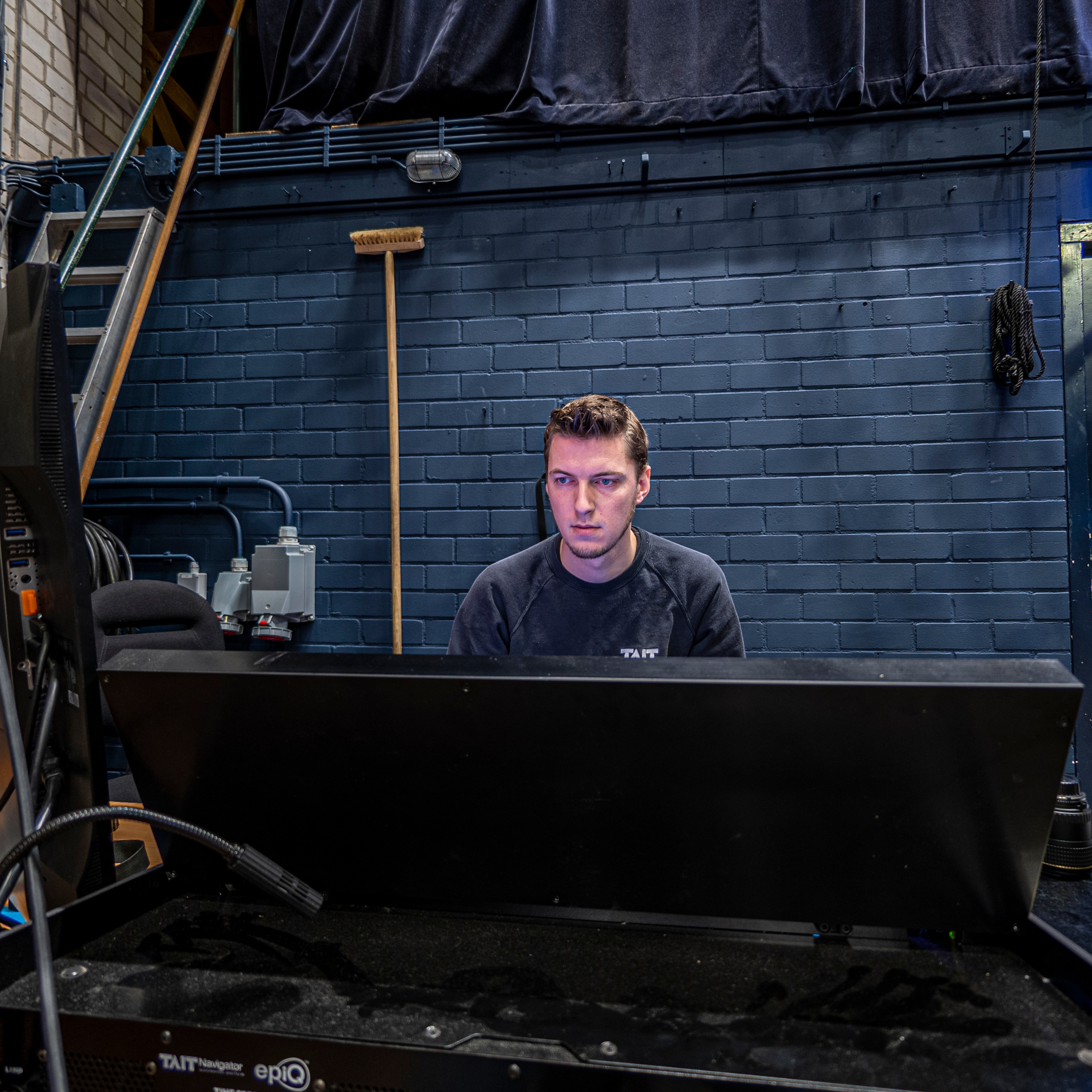 Theater de Maagd shot of male working behind the scenes