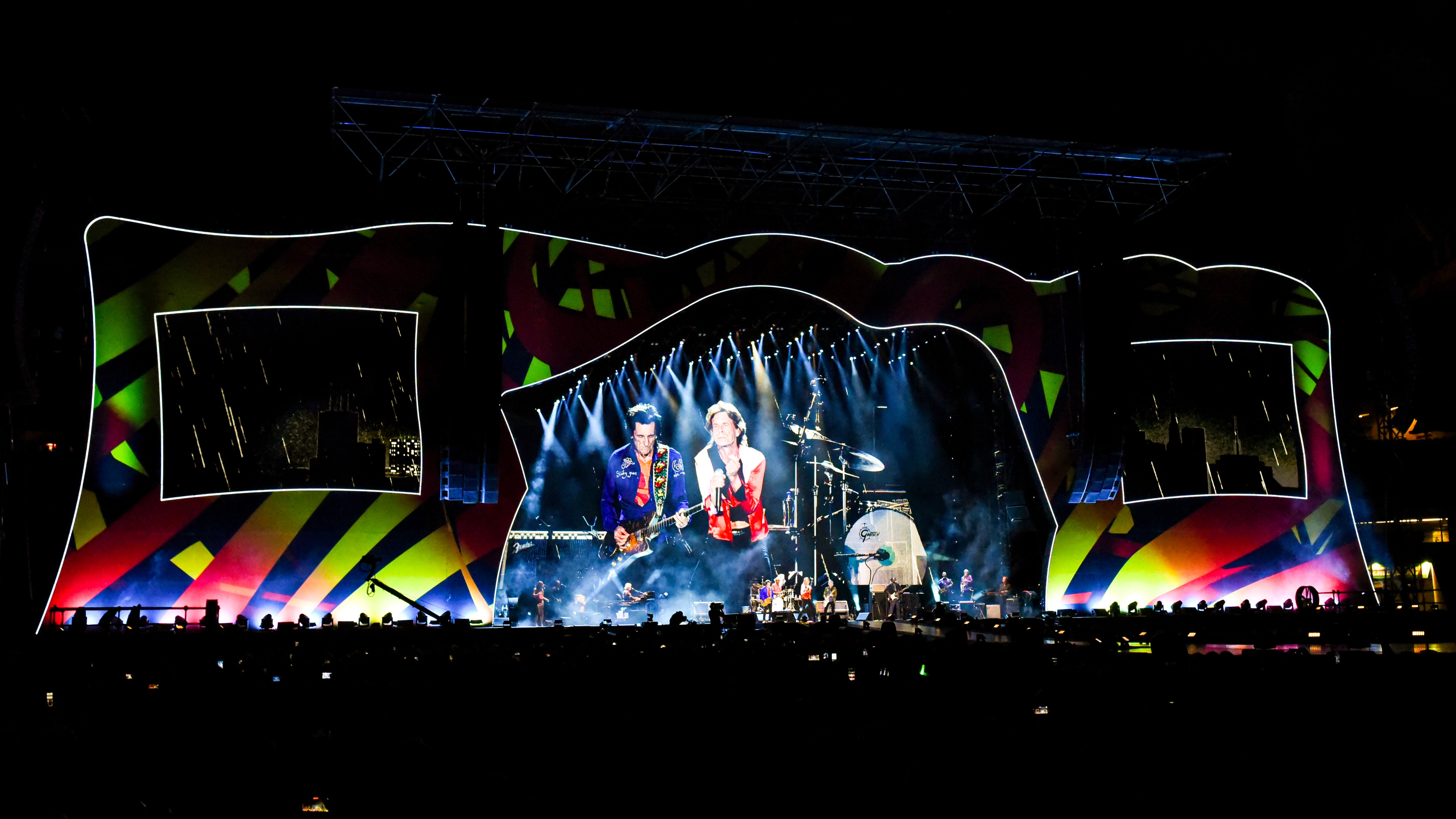The Rolling Stones performing on stage at night