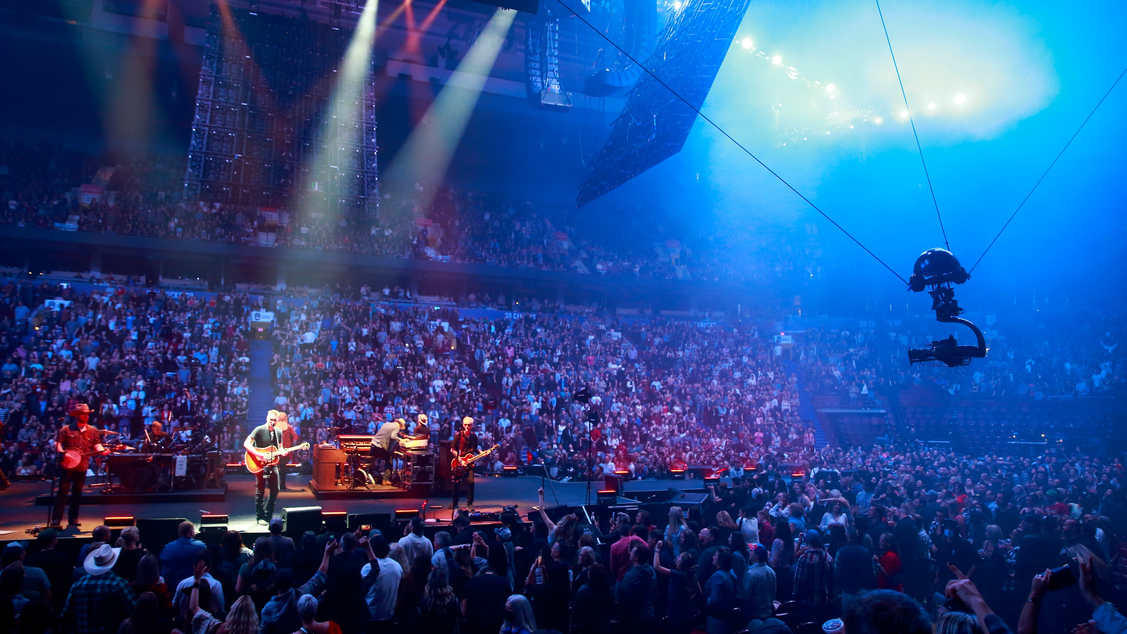 Medium shot featuring the flying TAIT Navigator camera's system capturing Erich Church and band performing on stage