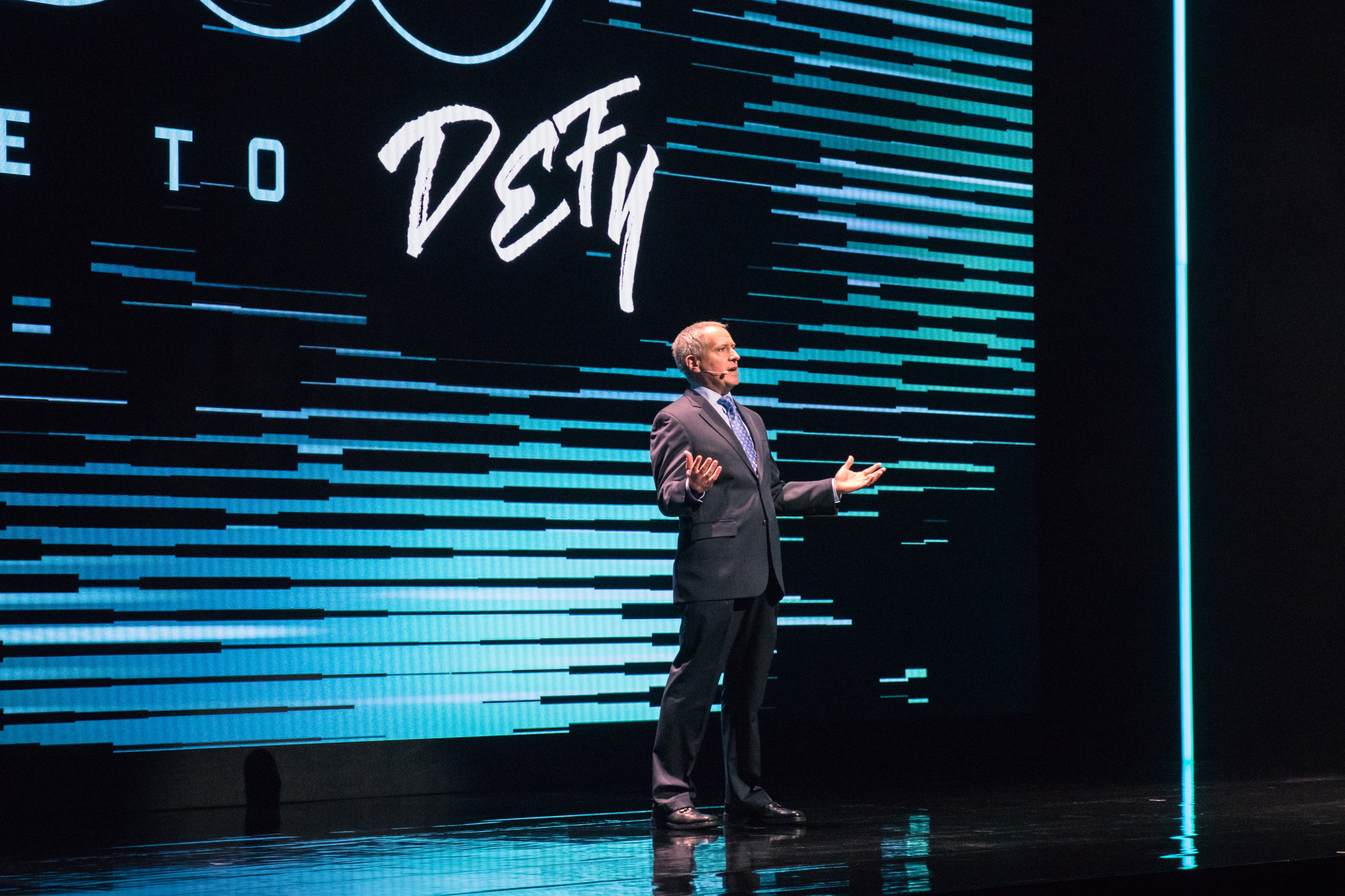 Man on stage speaking during CW Upfront