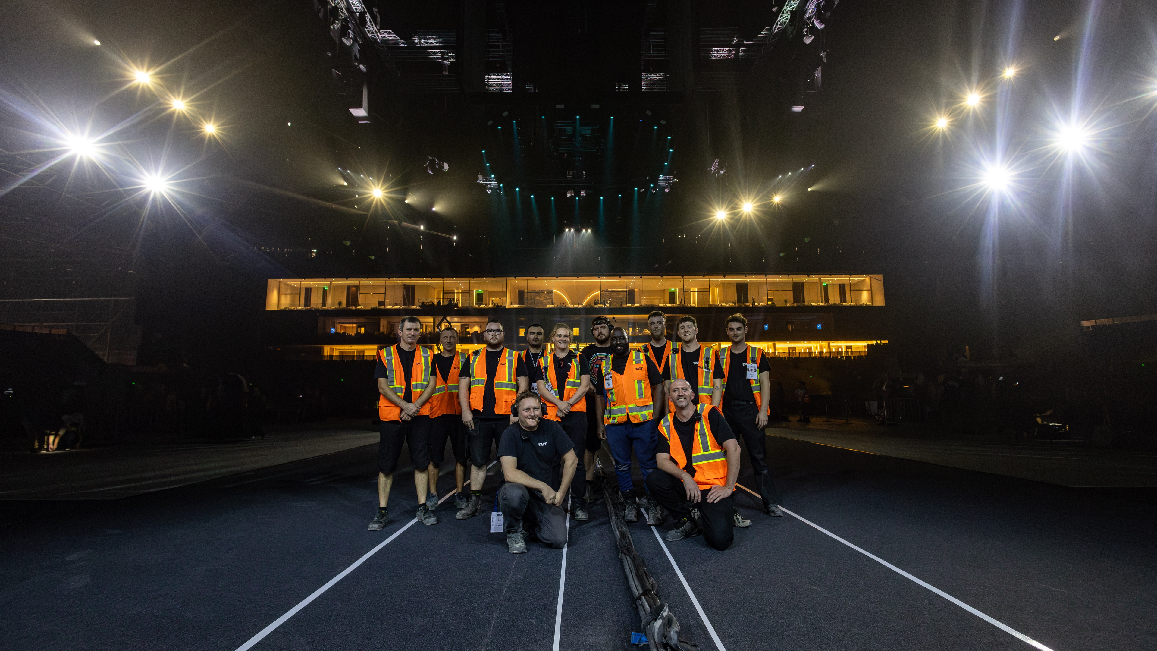 TAIT team posing for group photo in safety vests