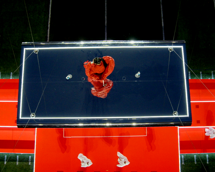 top down view of Rihanna performing on a floating stage