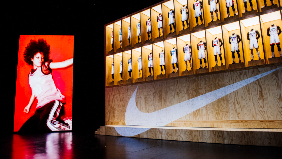 dynamic shot of uniform display next to screen displaying person in motion