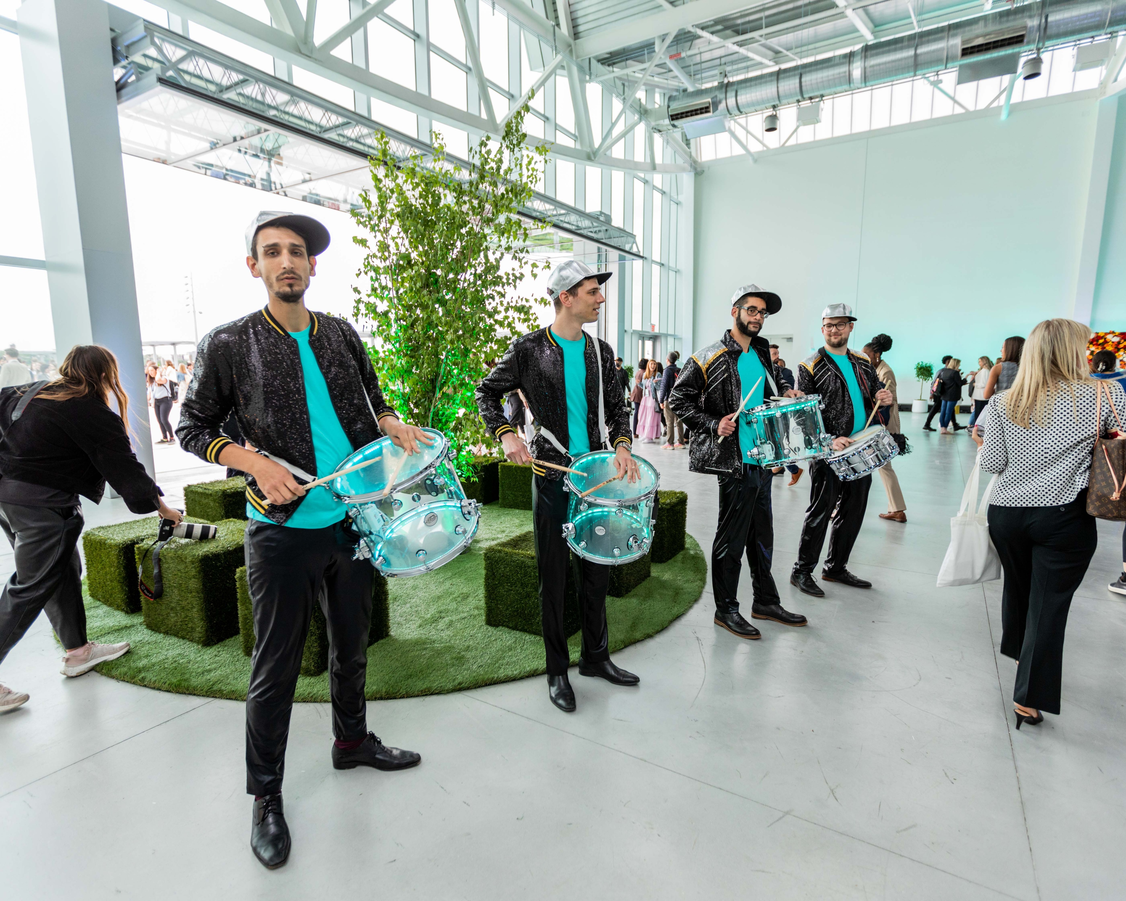 Perfomers playing drums in lobby of conference centre