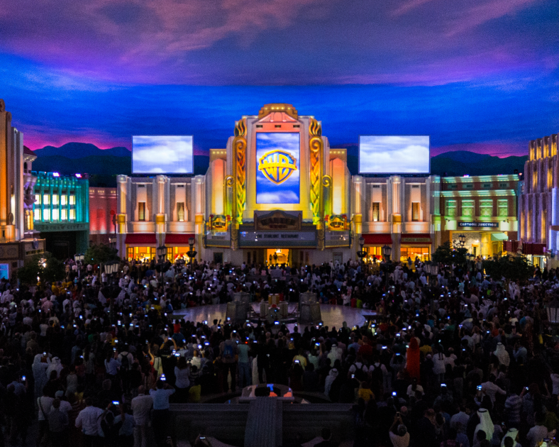 room full of people surrounded by buildings
