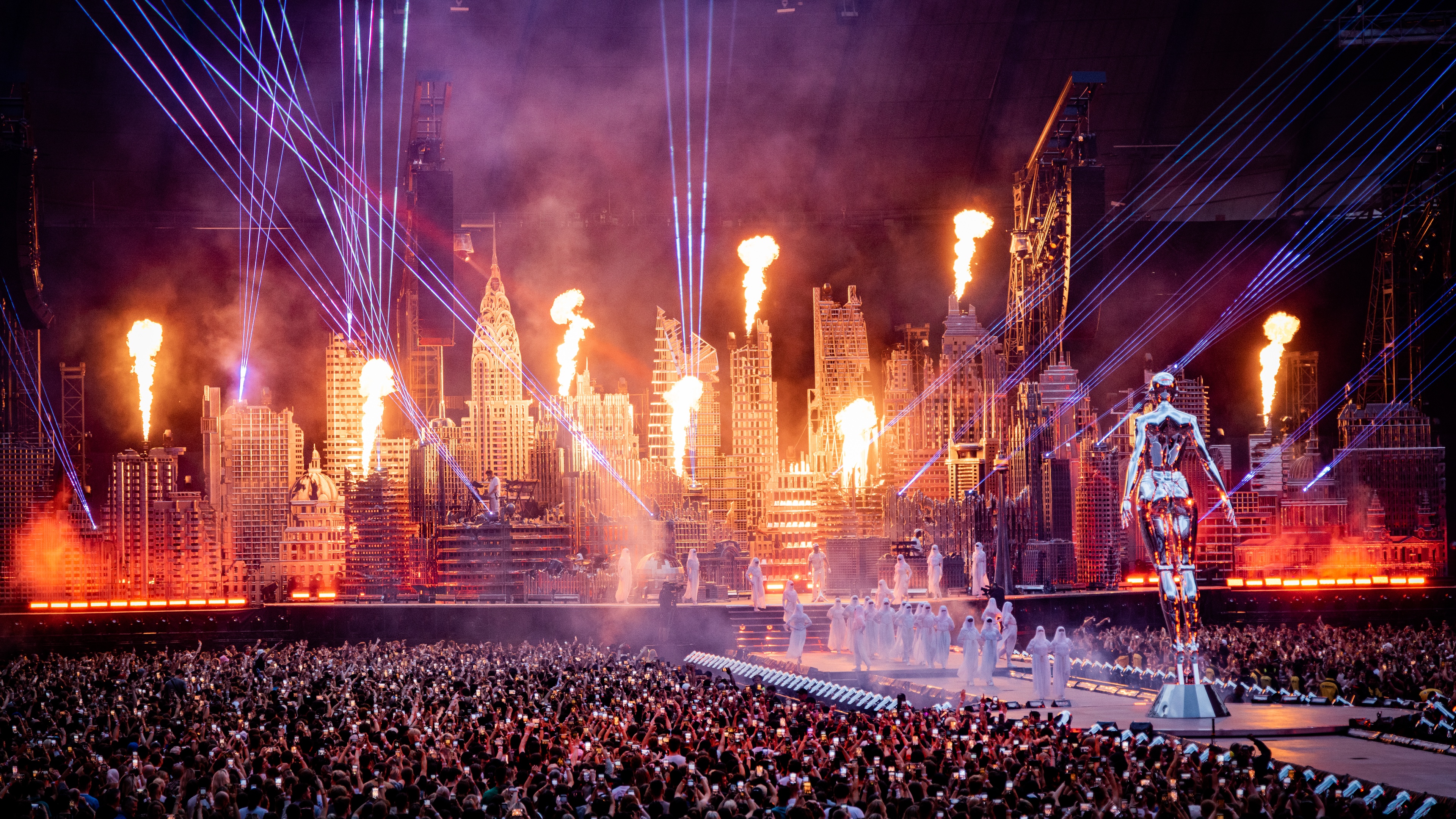 The Weend Stage set up including huge metallic scenic sculpture dystopian city skyline pyro elements strobe lighting