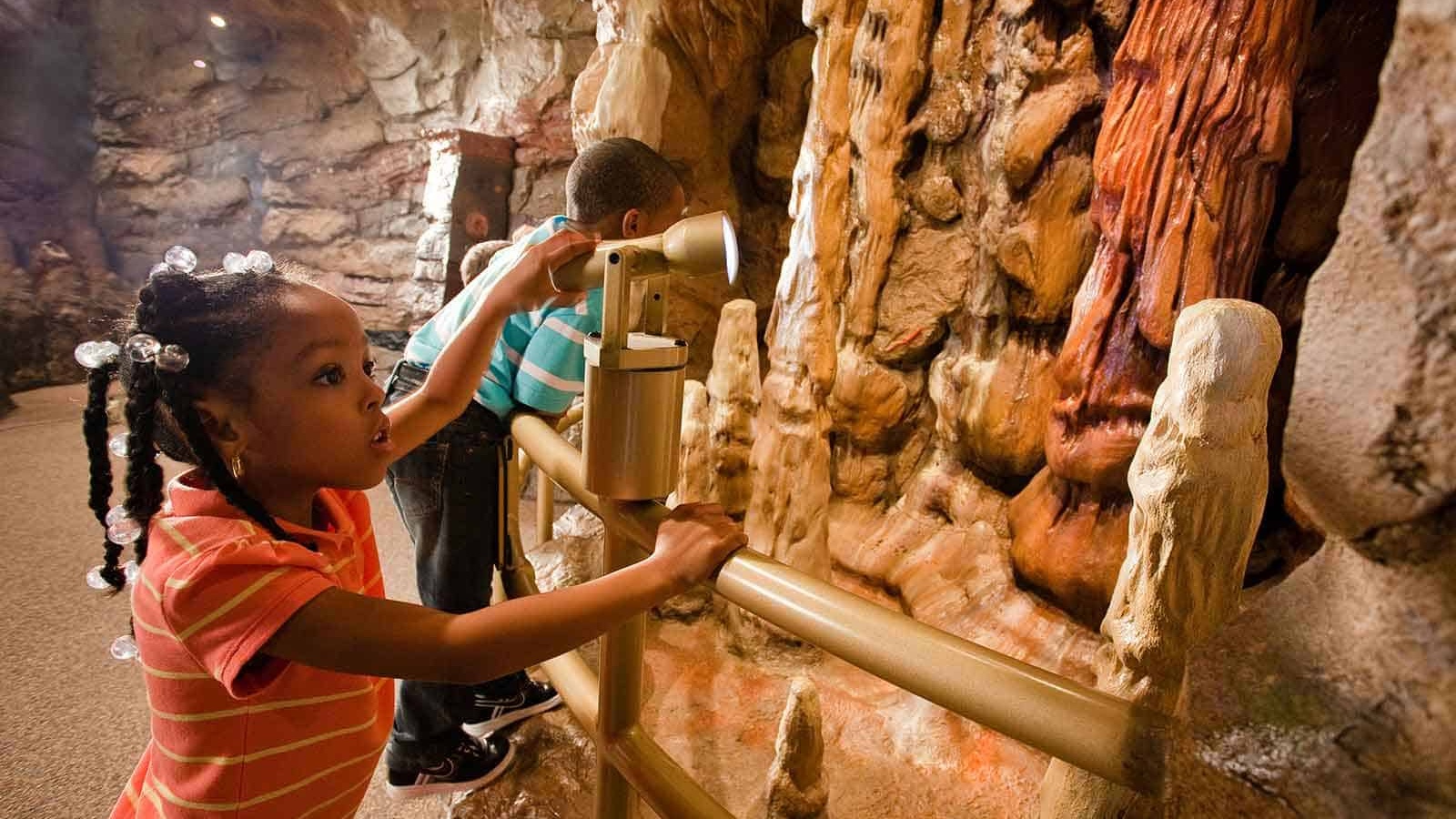 Interactive exhibit with little girl playing