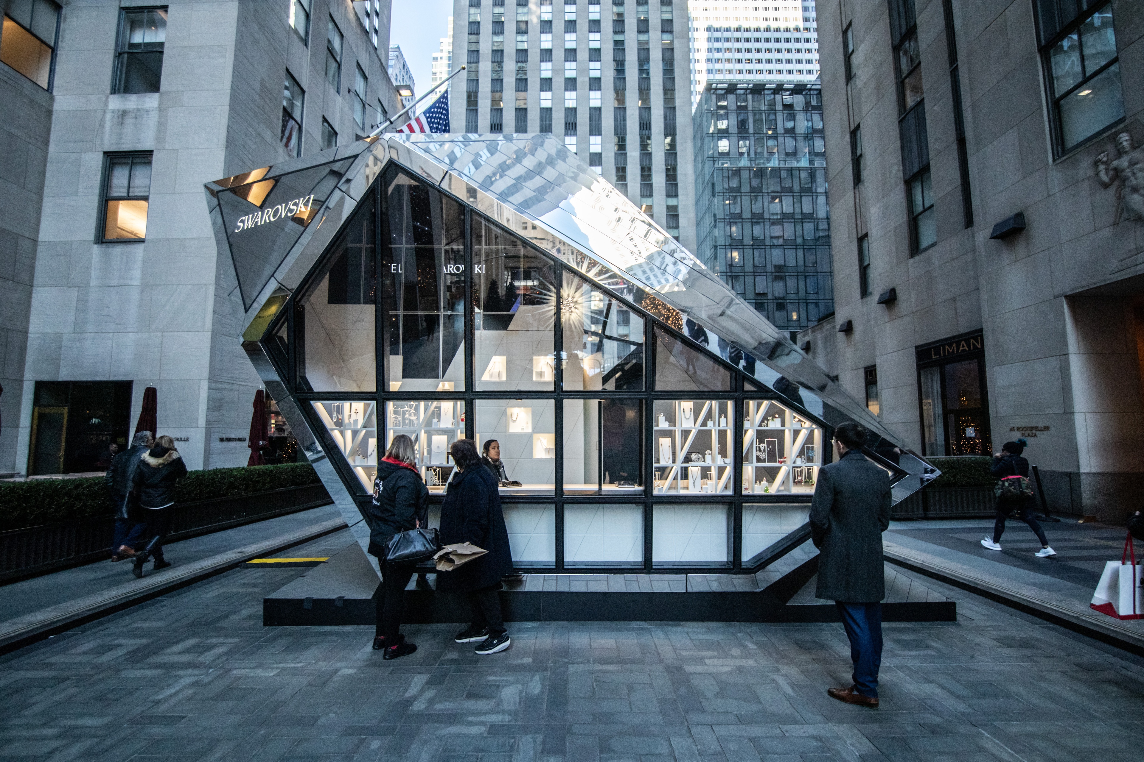 Swarovski glass pop up boutique with guests around it
