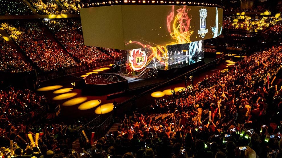 Stadium full of people with yellow lighting