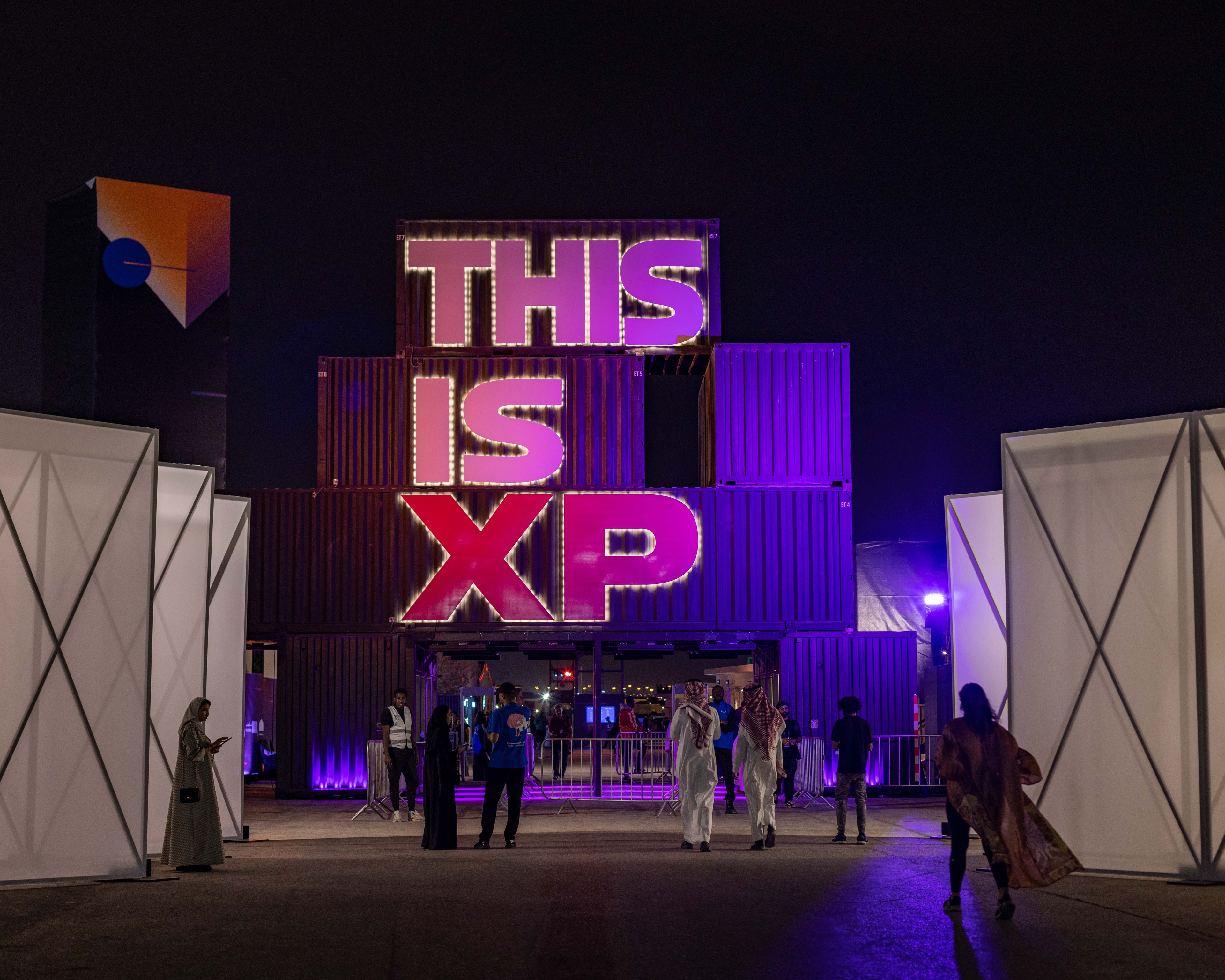 Large sign made out of shipping containers with the text THIS IS XP