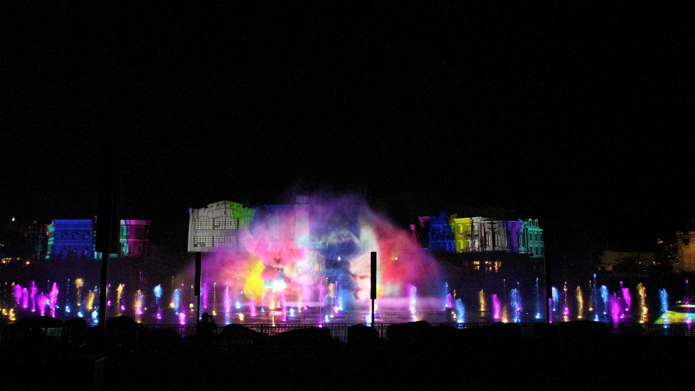 Light show at night with rainbow lights