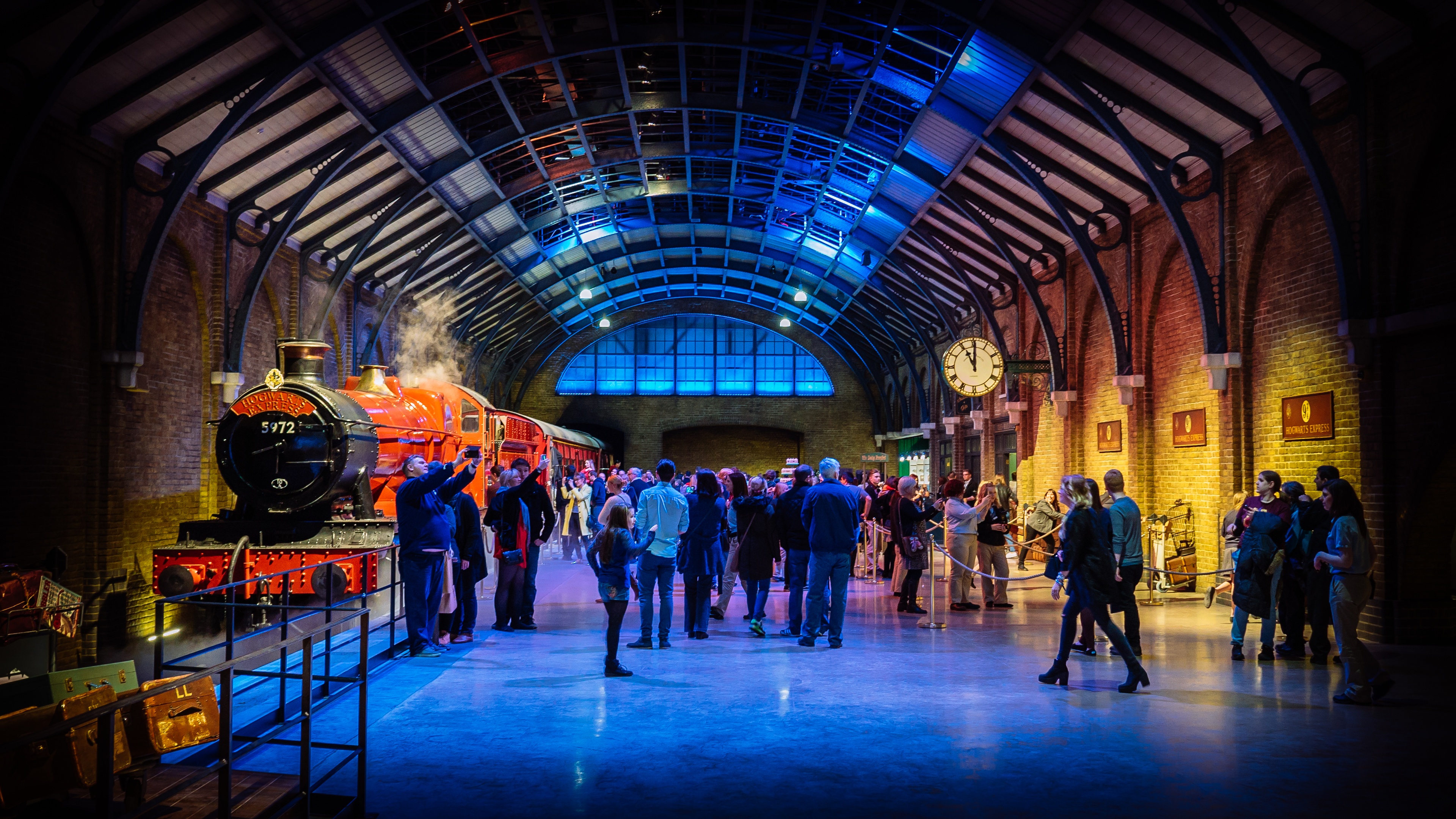 image of family and crowd posing in front of harry potter train